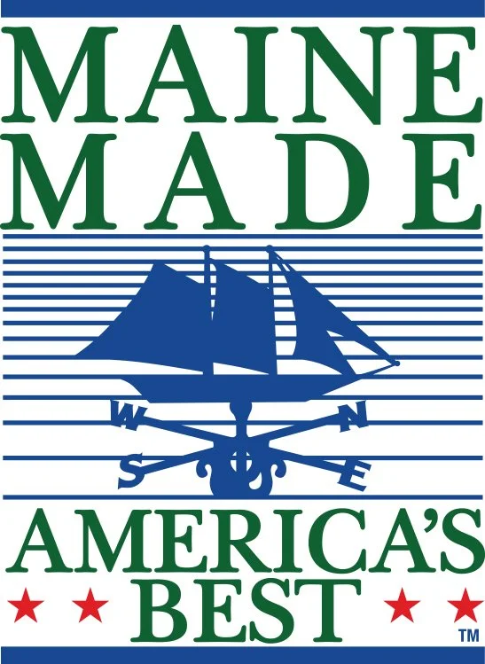 Logo with "Maine Made" at the top, a blue sailing ship and compass illustration in the center, and "America's Best" at the bottom, featuring stars.