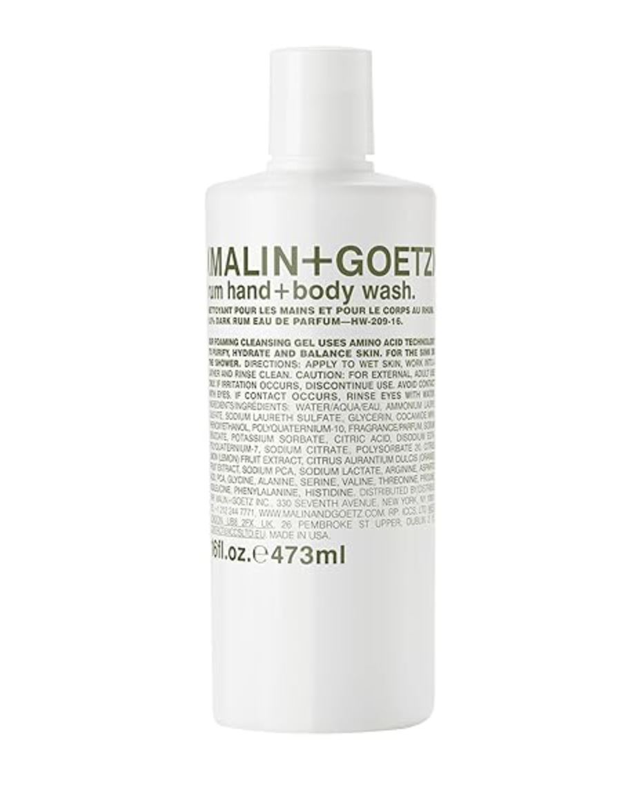 A bottle of Malin+Goetz Rum Hand and Body Wash, a premium foaming cleansing gel for men featuring a warm rum scent and amino acid technology.