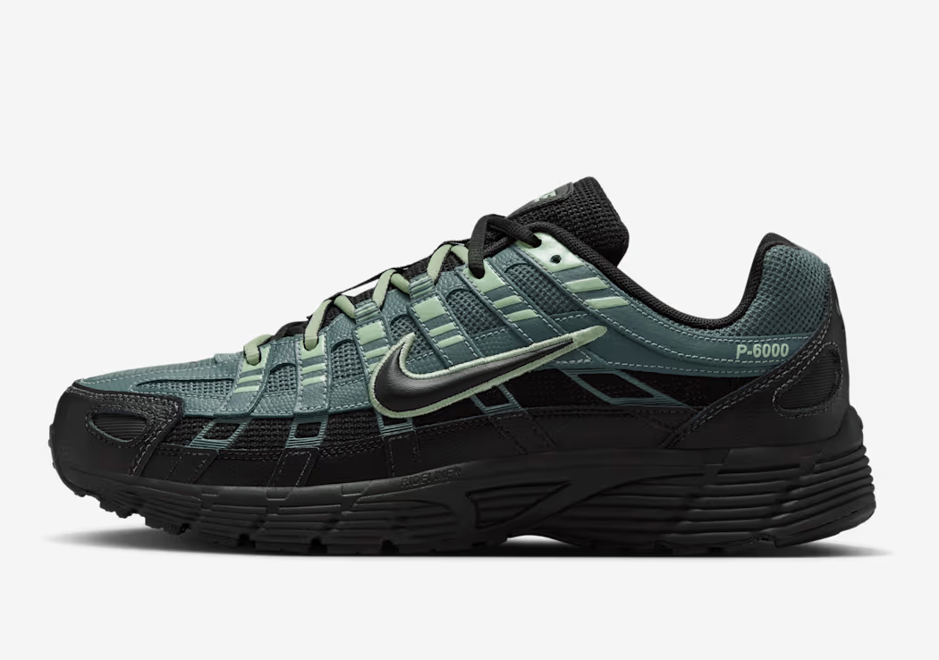 A pair of Nike P-6000 sneakers in a black and dark green colorway with silver accents, featuring a chunky retro silhouette and mesh panels for a 2026 men's style.