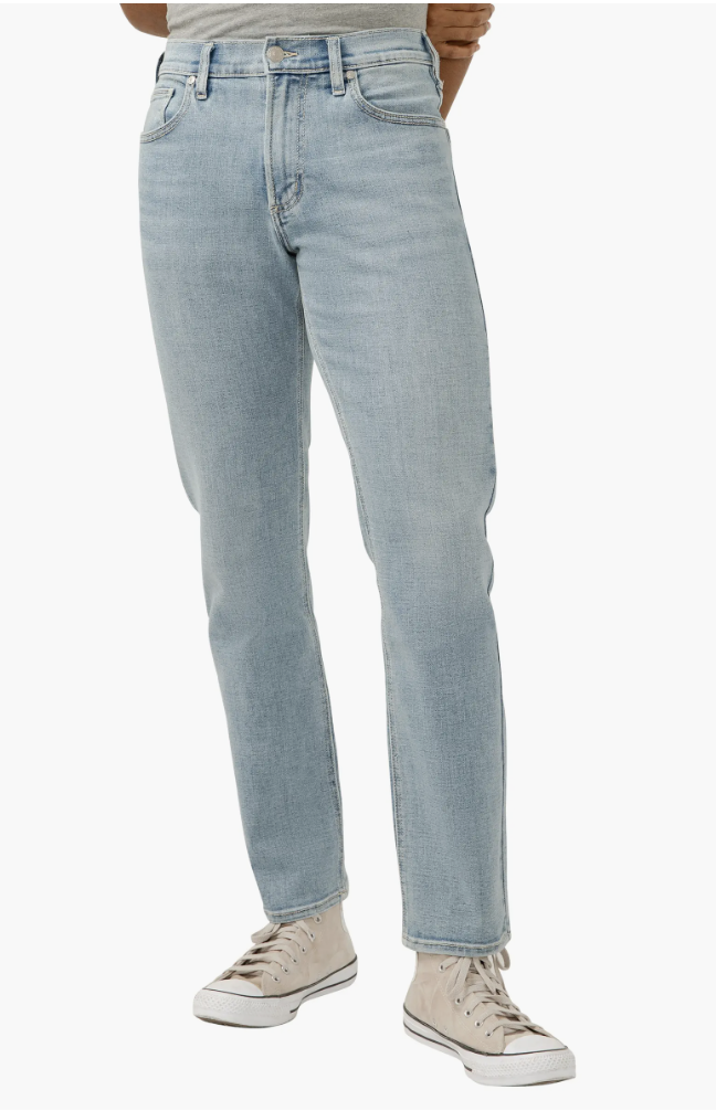 Silver Jeans Co. Eddie Athletic Fit jeans in a light indigo wash, showing the extra room in the thigh and the sharp tapered leg opening.