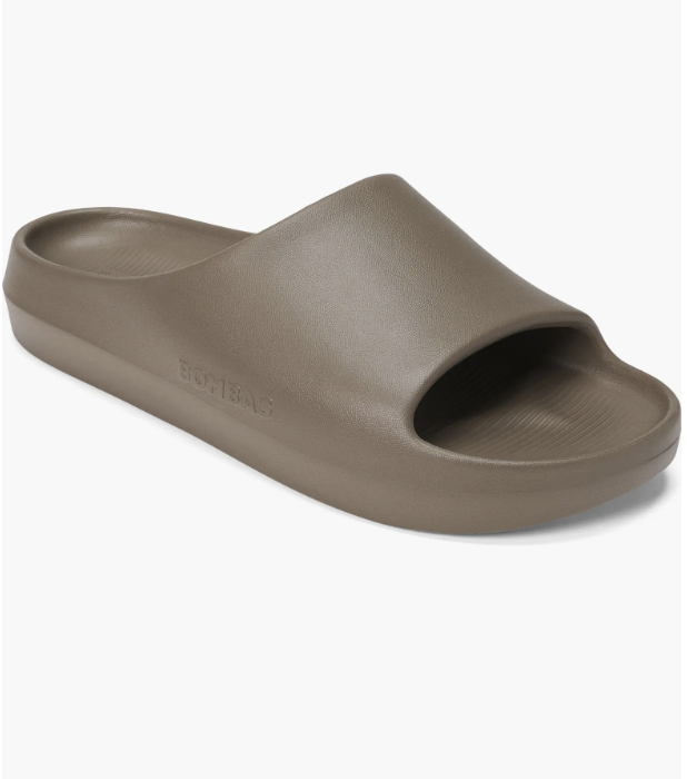 A pair of Mushroom Grey Bombas Friday Slide sandals for men, featuring a lightweight EVA construction and a minimalist one-piece design.