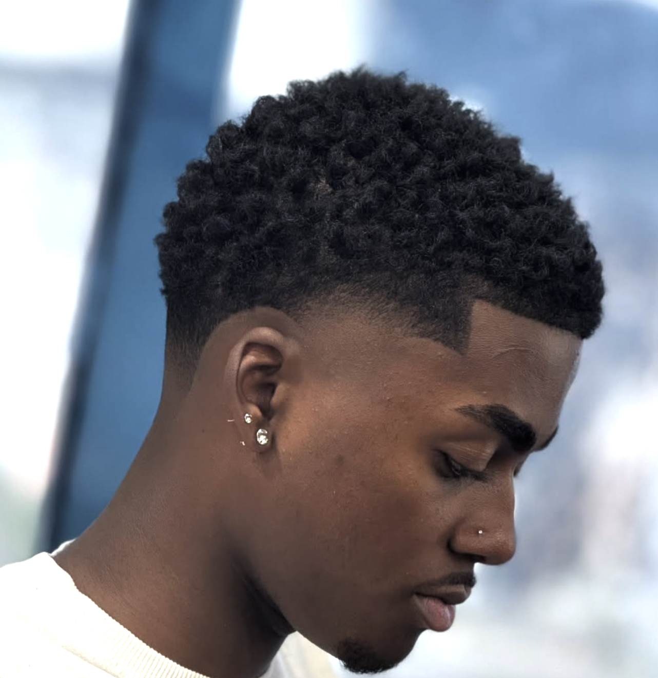 taper fade with curls haircut