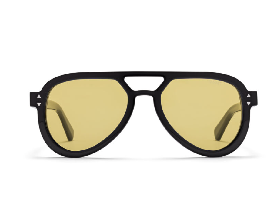 A close-up studio shot of MVMT Hollywood Aviator sunglasses featuring a sleek matte black aviator frame with a prominent double bridge and vibrant tinted yellow lenses.