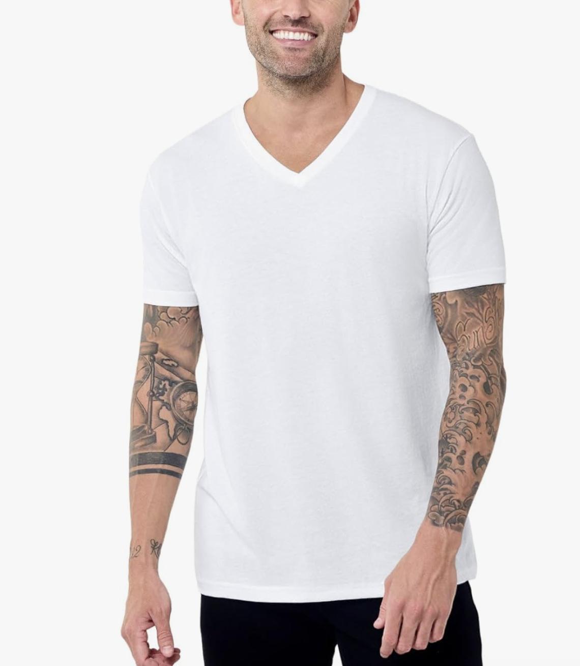 Close-up of a man with arm tattoos wearing a bright white, fitted V-neck t-shirt, demonstrating a modern athletic fit for men.