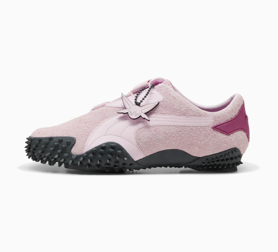 PUMA x Pokémon Mostro "Espeon" in pearl pink suede with an adjustable strap, an Espeon charm and a spiked grey sole.