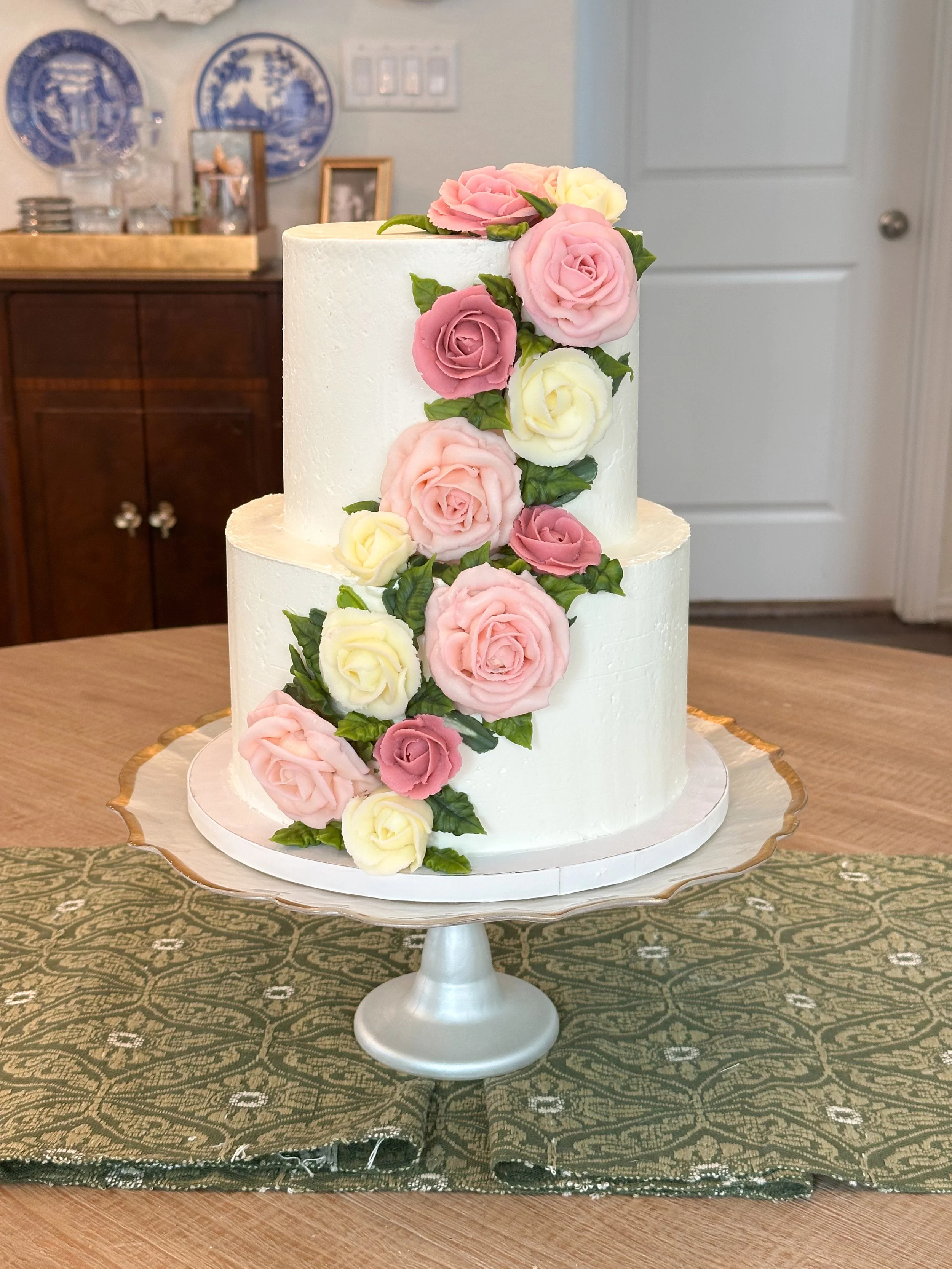 tiered cake with roses.jpeg