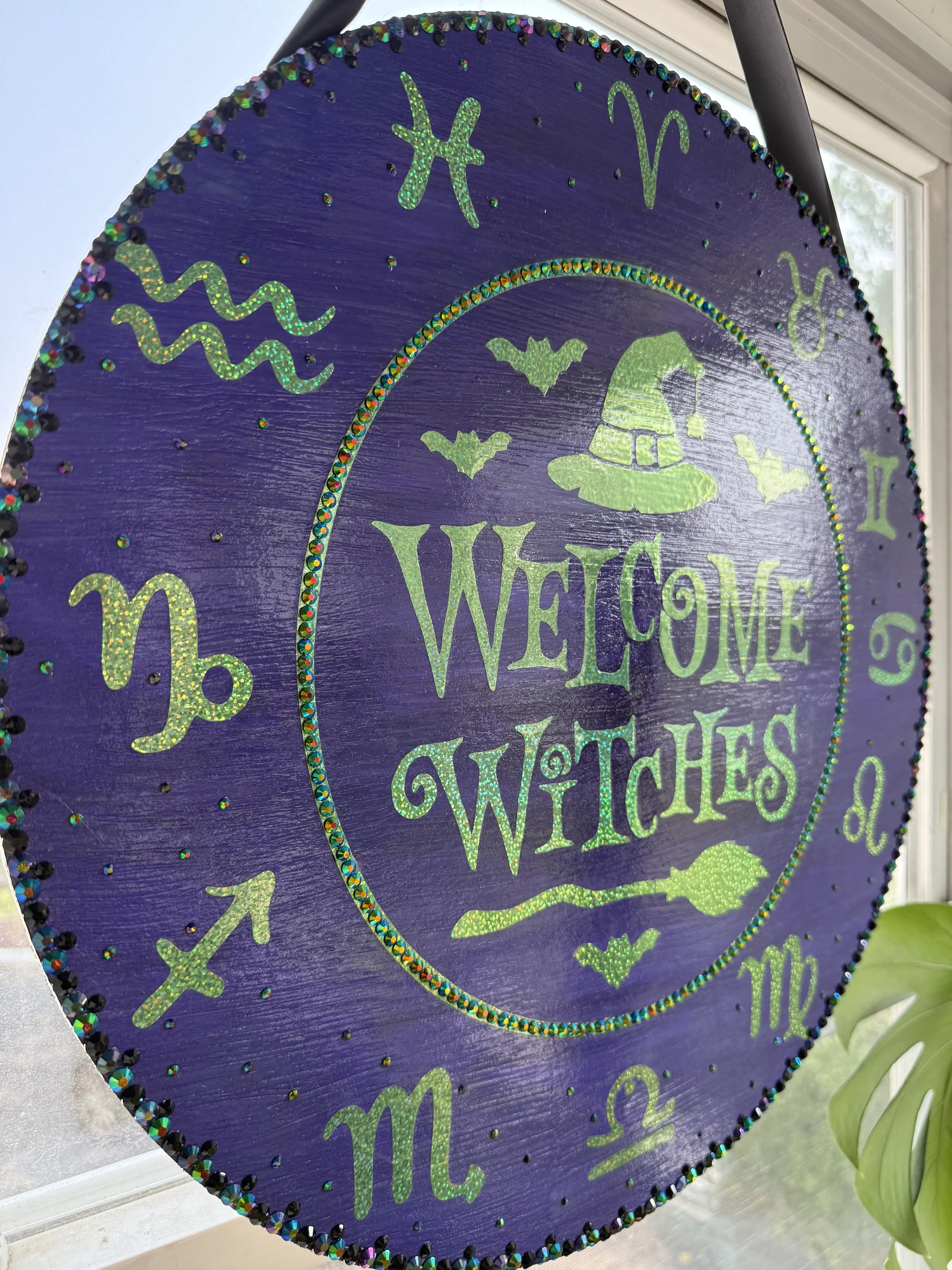 "Welcome Witches"  Front door hanging sign. Featuring iridescent zodiac symbols and embellished with rhinestones. 
