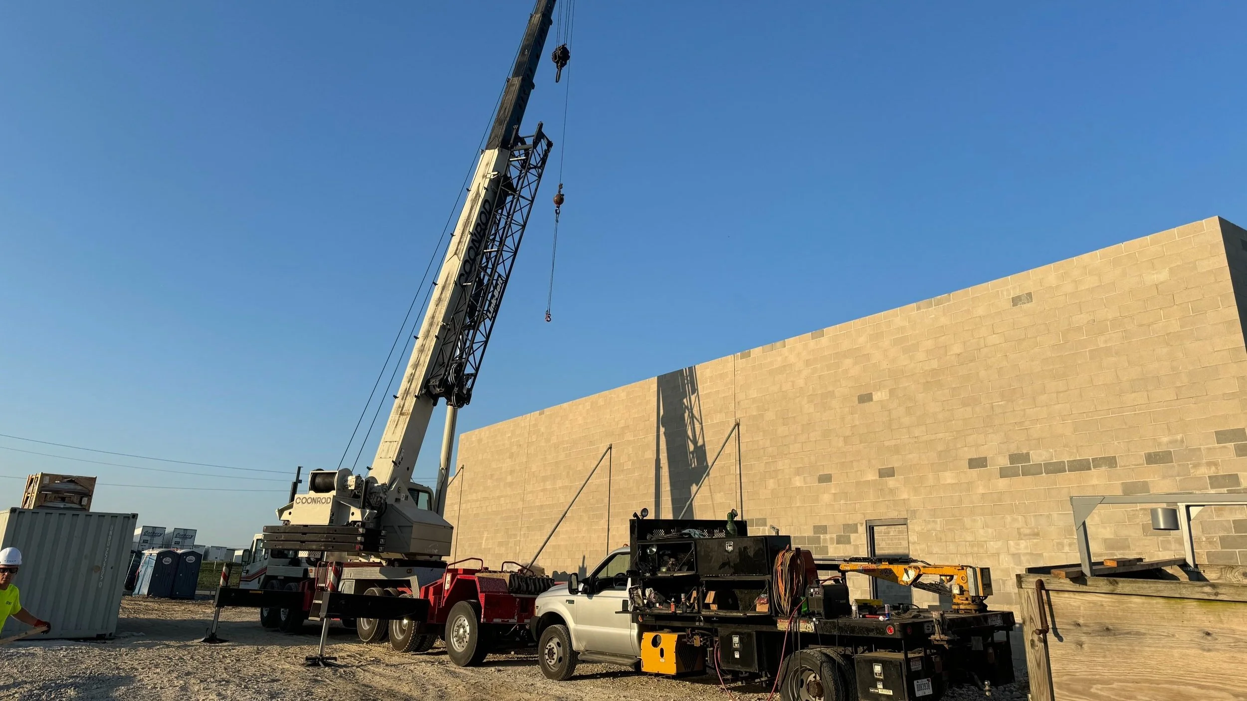 Oranssi technician working on a roof project