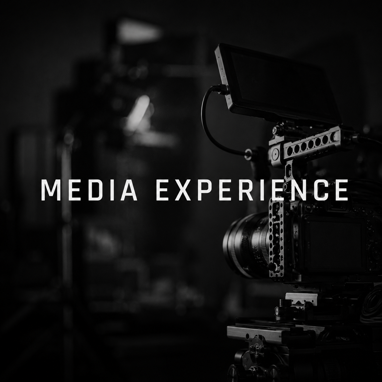 Black and white photo of a professional video camera with on-screen text 'Media Experience' in the foreground.