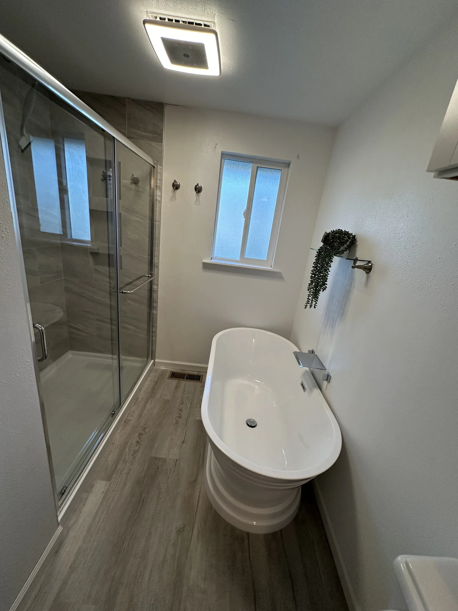 Bathtub, faucet and shower fixtures in a bathroom plumbing project