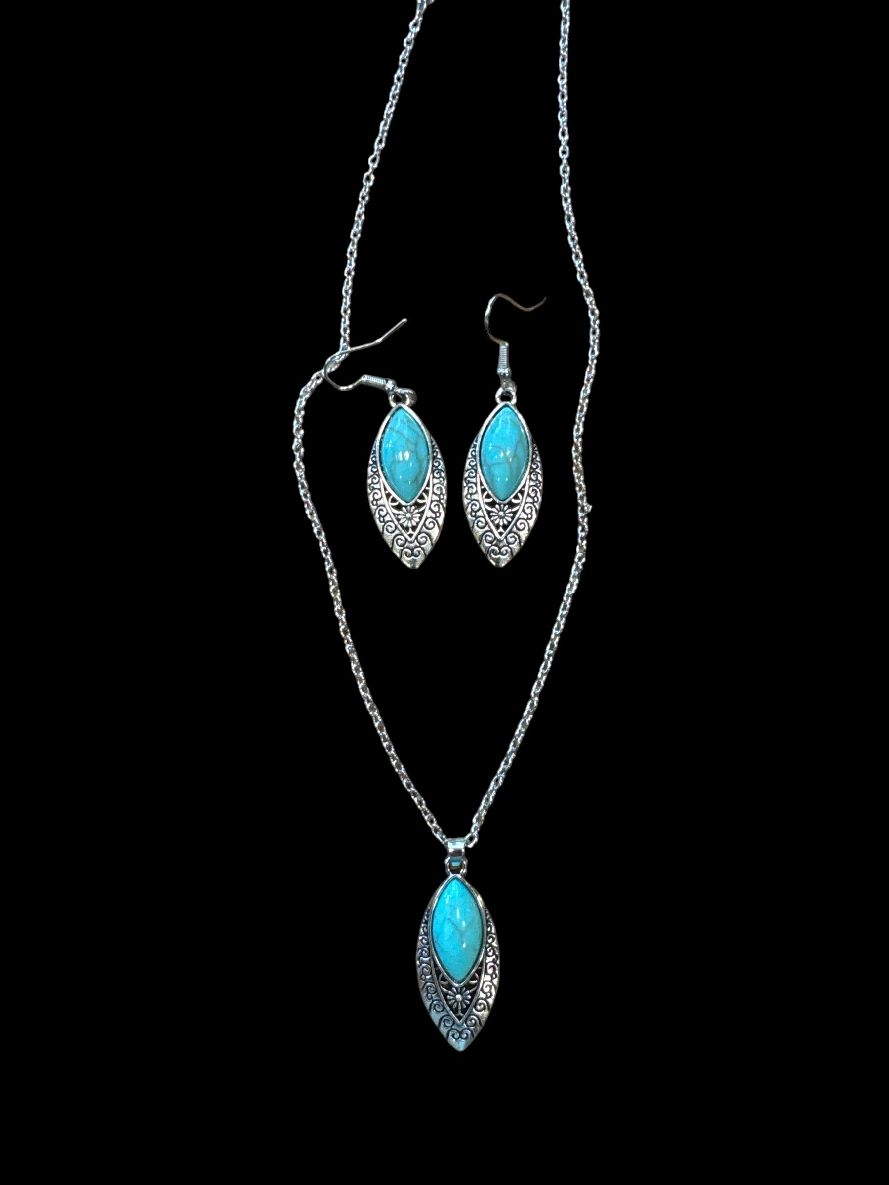 Item 707. Necklace and earrings Oval turquoise colored stone with silver setting.