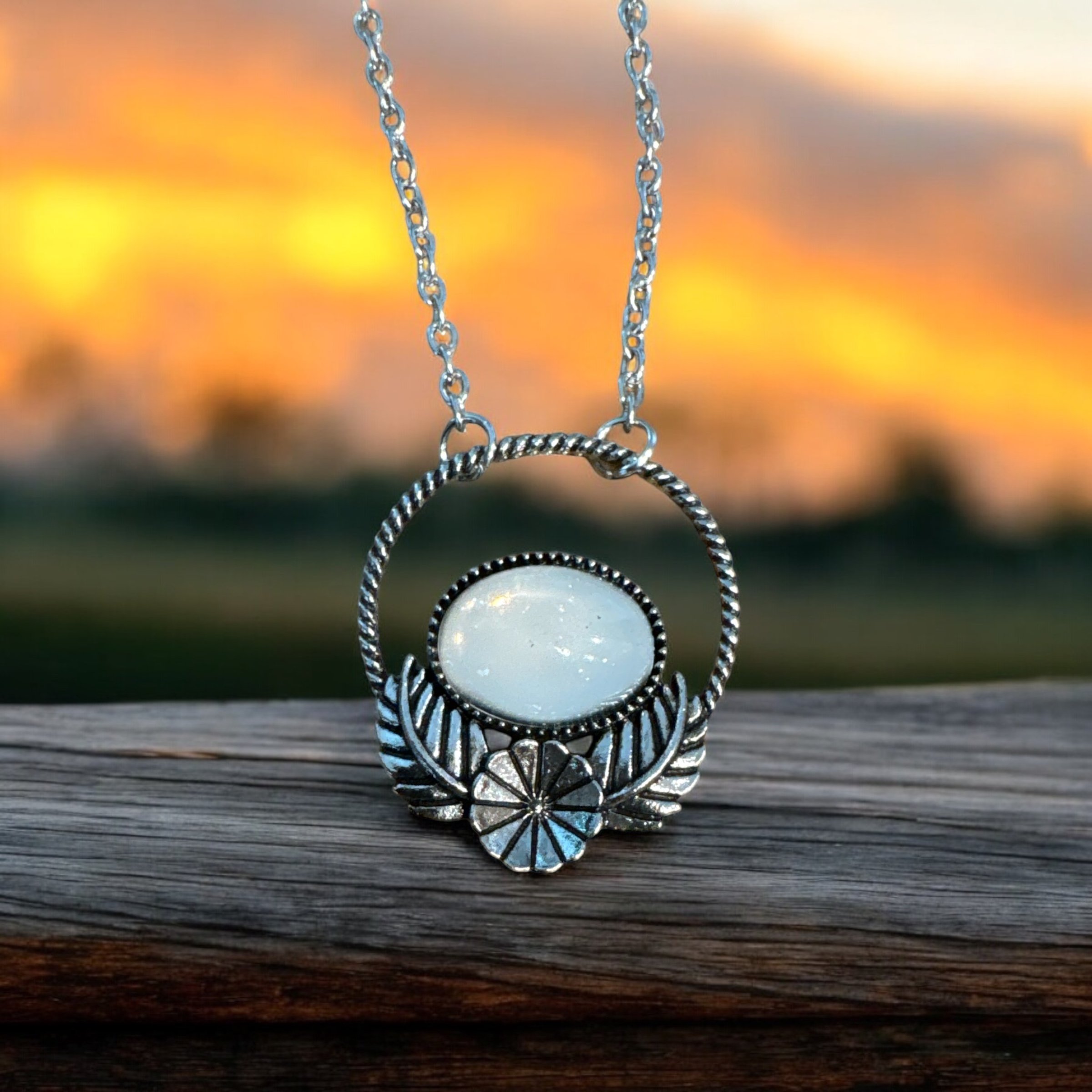 Item 665. Necklace with white like Opal stone with silver flower and leaves setting