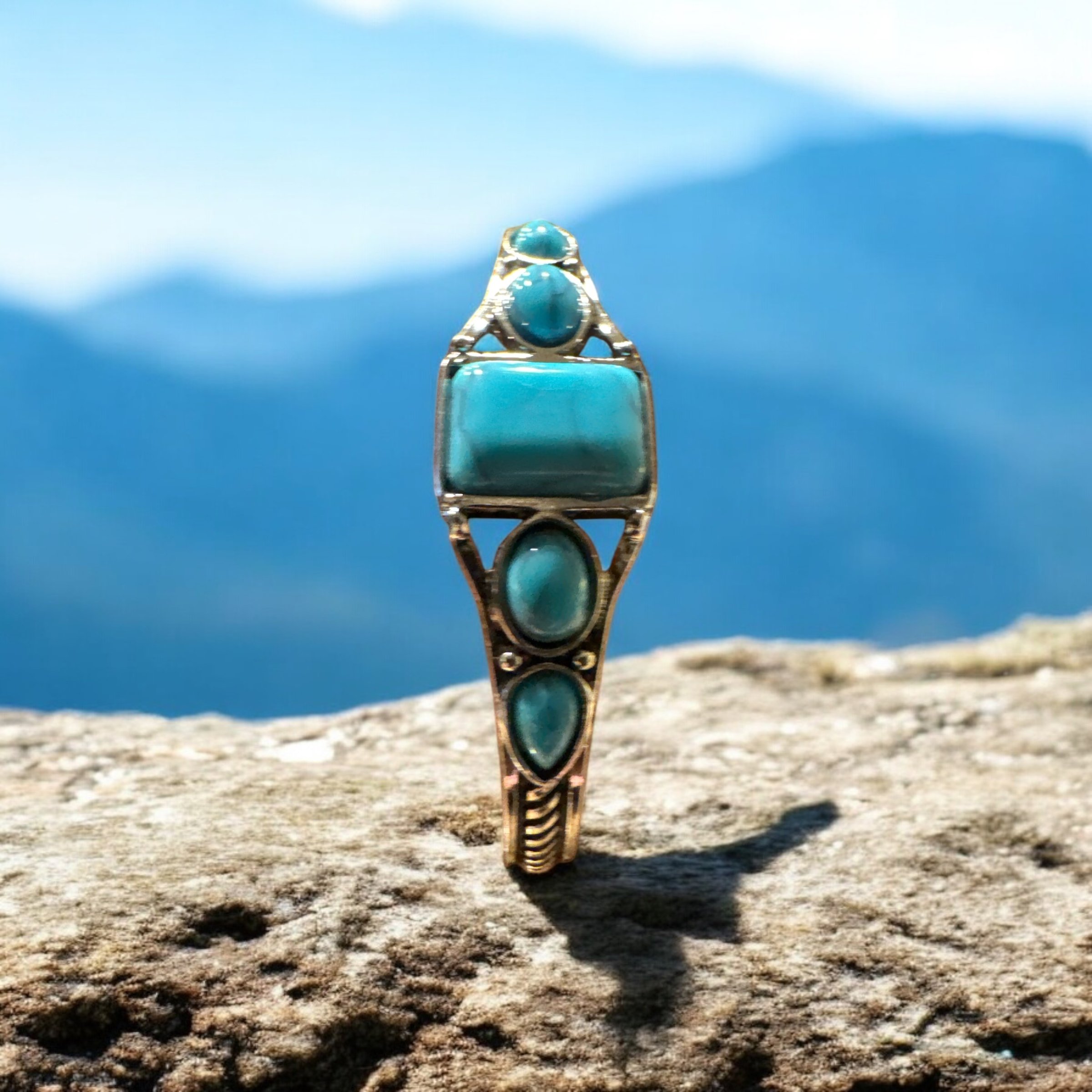 Item 719. Square center turquoise stone with circle and tear drops Bangle bracelet