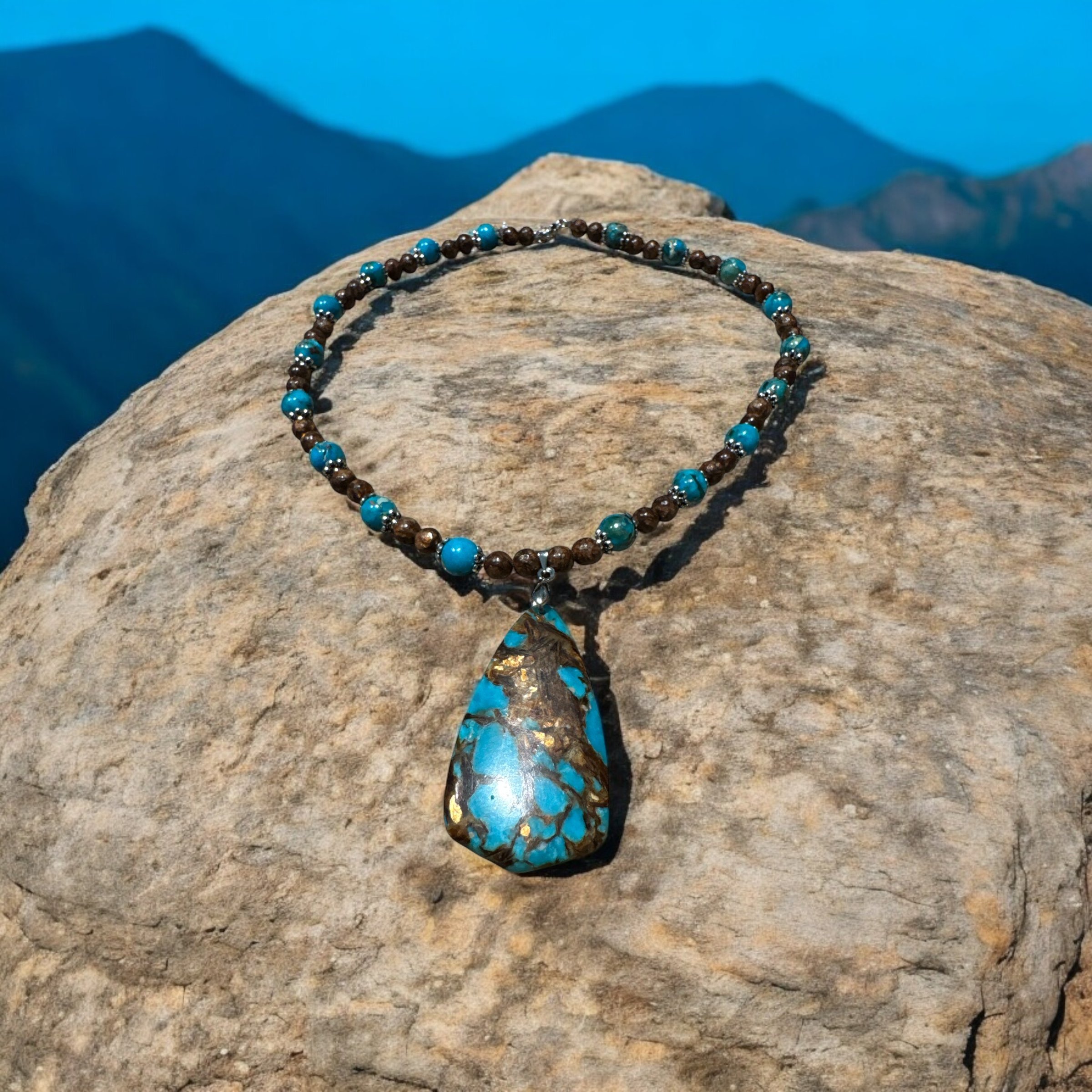 Item 608 Necklace Lrg teardrop stone of brown/gold/turquoise. with brown and multilcolor beads