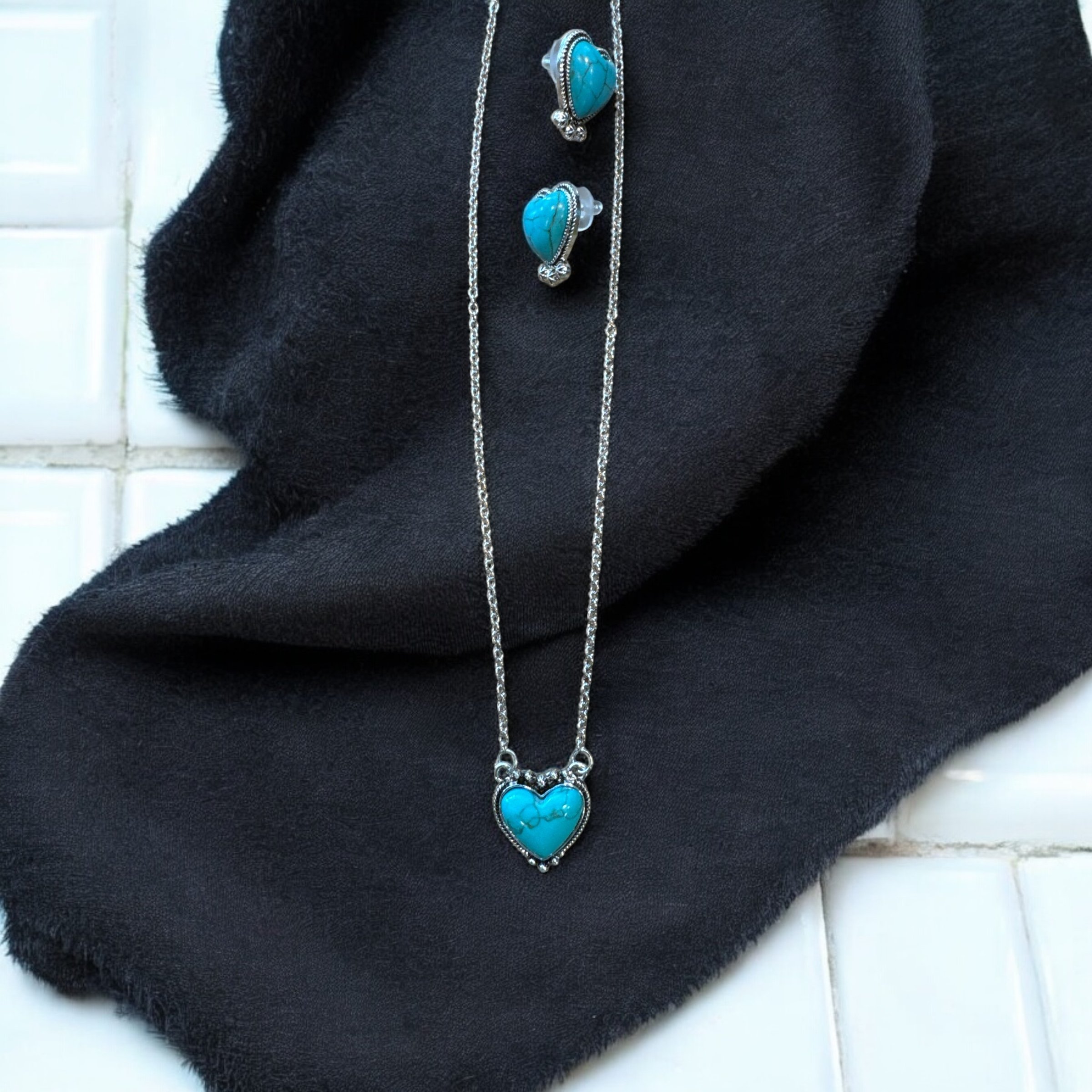 Item 708. Necklace and earrings set in turquoise colored stones in silver setting