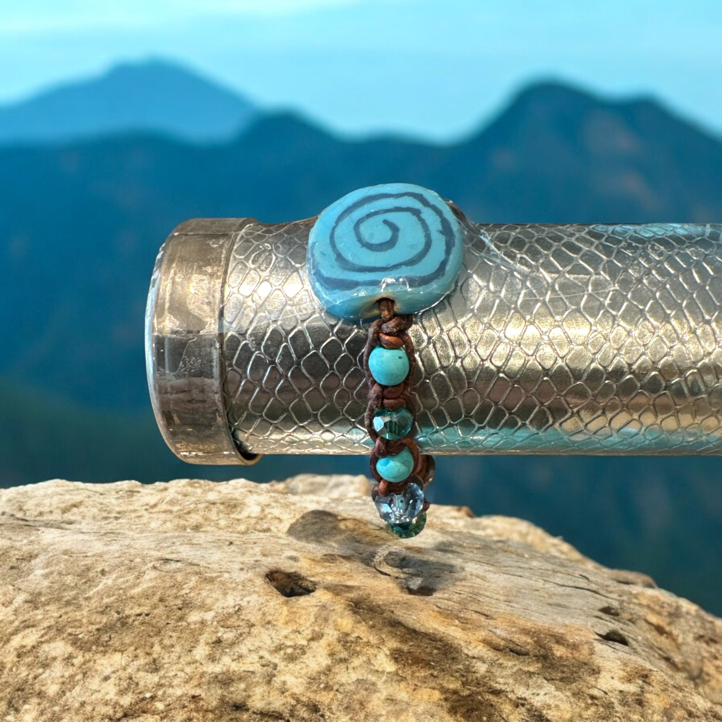 Item 595 Bracelet with turquoise center stone with turquoise and leather weave strap