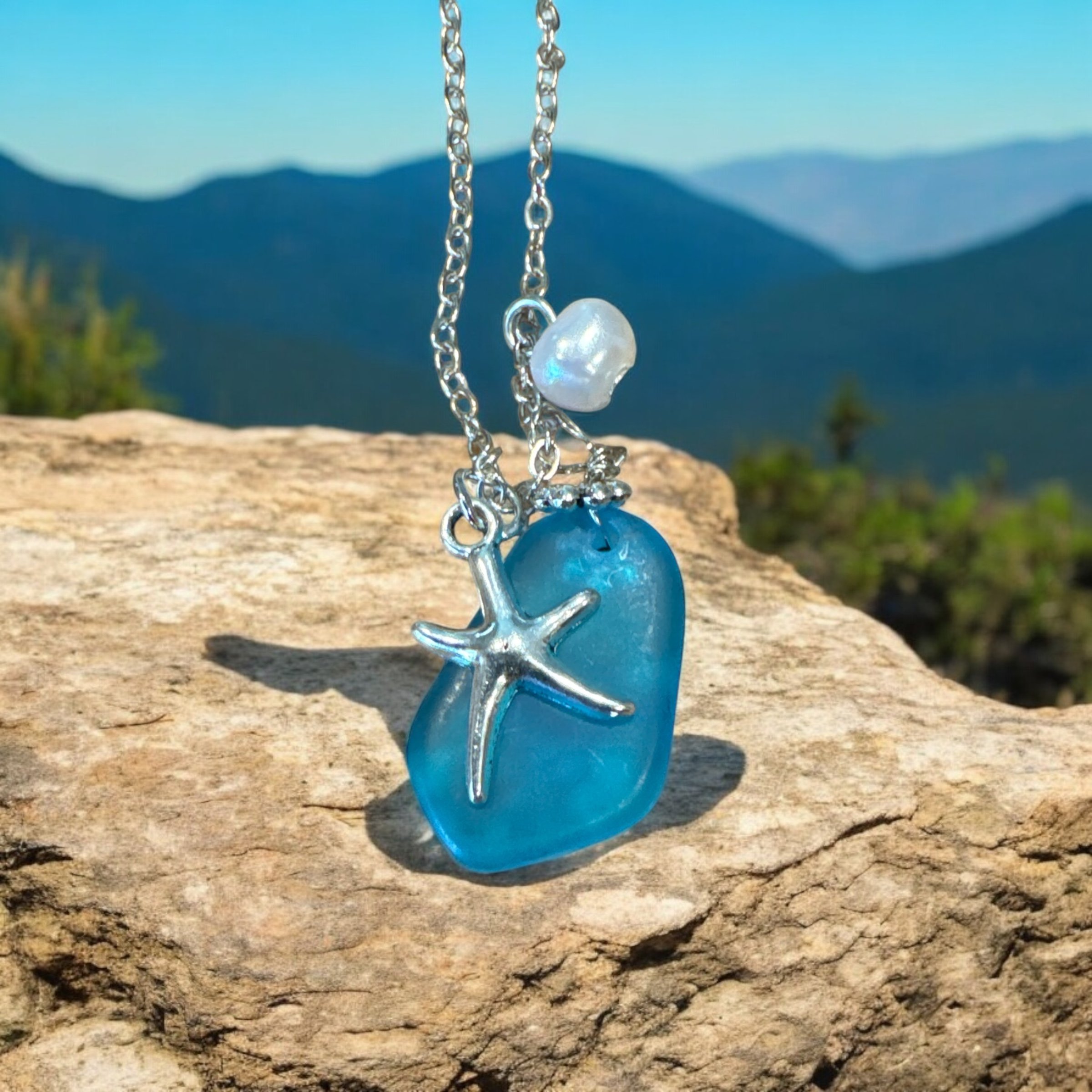 Item 682. Blue stone with a charm