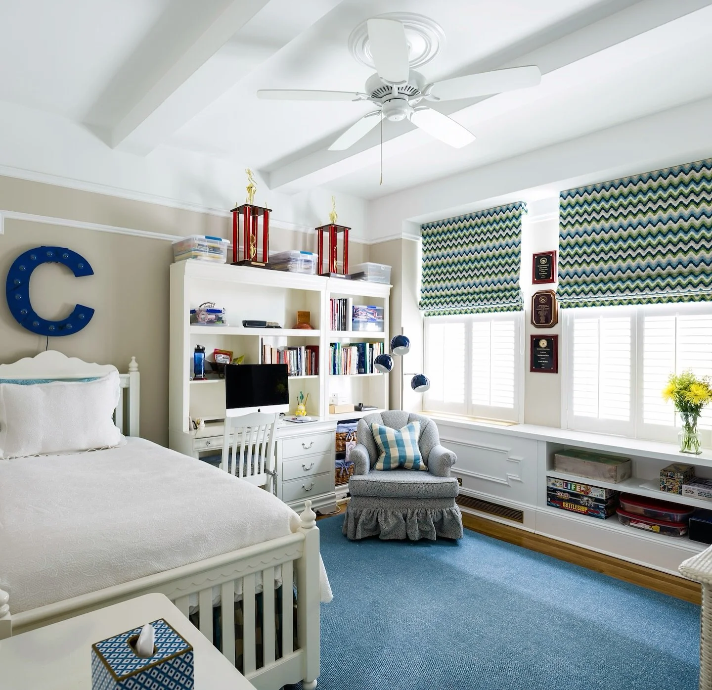 Built for board games now, study sessions later. 
 
This is a kid&rsquo;s room designed to evolve gracefully as a space that can keep up with a growing imagination (and growing piles of books). Built-ins do the heavy lifting, and low cubbies corral b