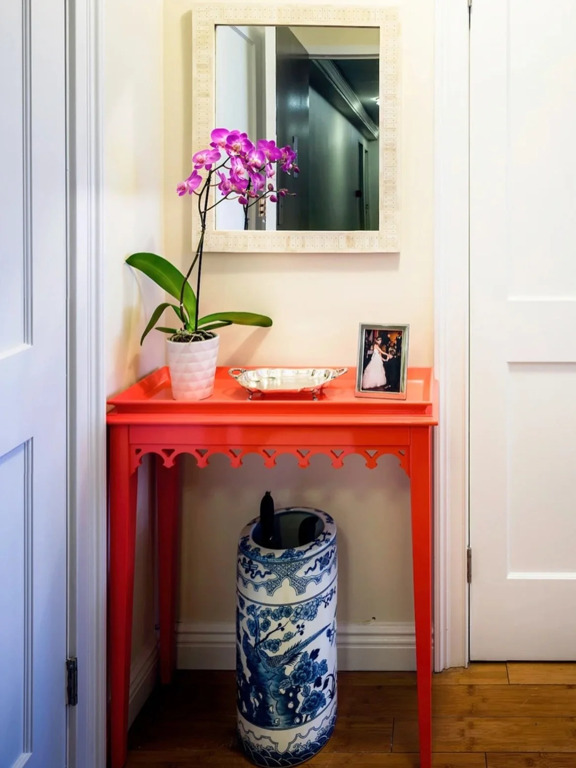 A bright, inviting, and personality-filled entryway In this Carnegie Hill condo!
 
This amazing @oomphhome console table sets the joyful tone. We paired it with a favorite @serenaandlily mirror and @scullyandscully umbrella stand for a mix that&rsquo