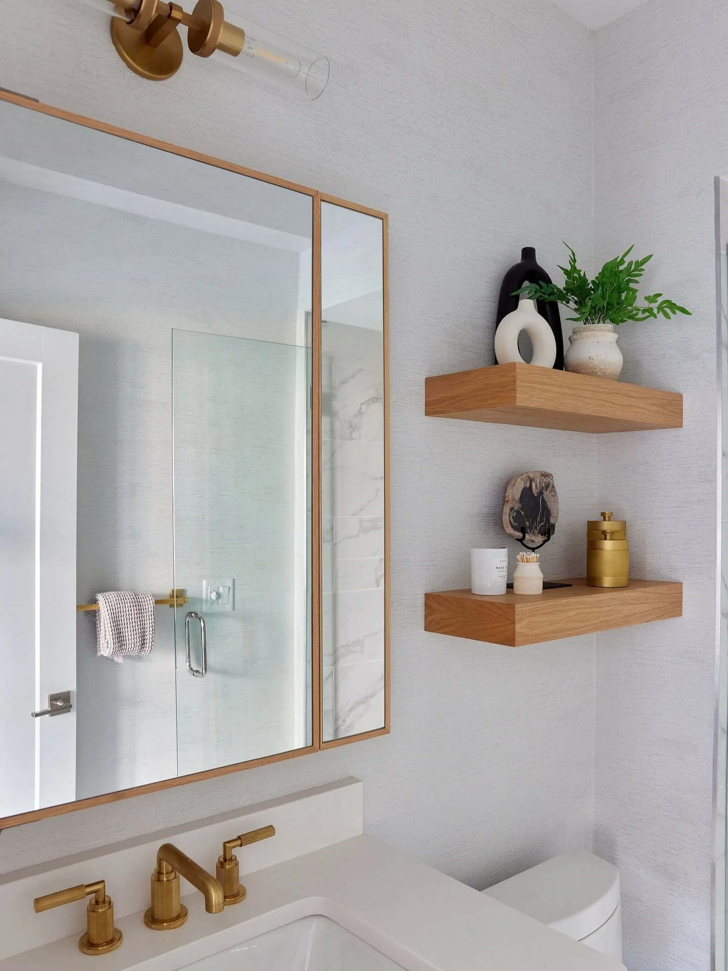 It&rsquo;s the little details that end up being favorites!

In this Sleepy Hollow townhouse bathroom, custom shelving and a medicine cabinet by C-Los bring function and intention, paired with a classic Restoration Hardware faucet. The small shelves a