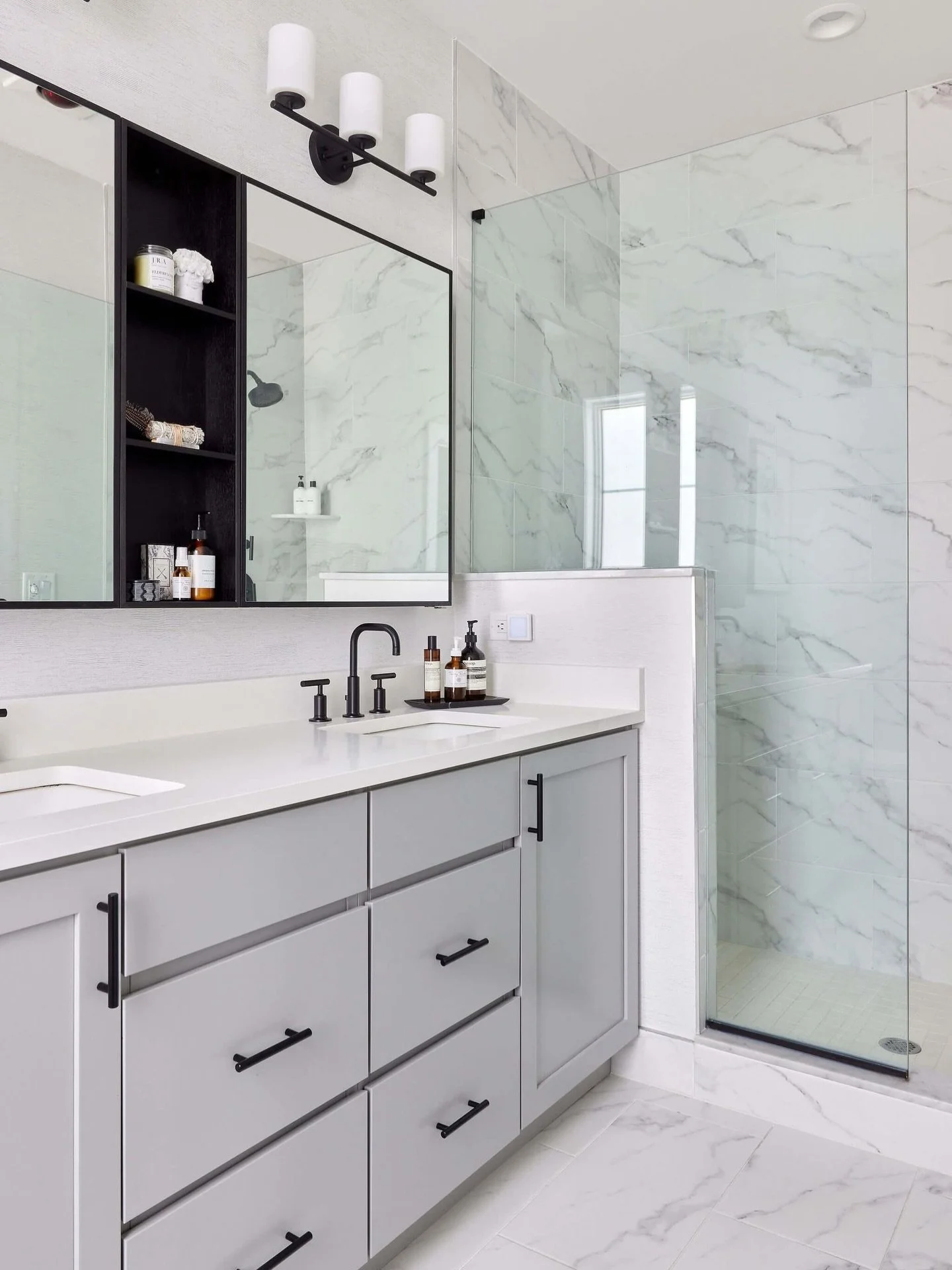 We love these bathroom details at our Edge-on-Hudson family townhouse project. 
 
Initially selected during the development phase of this community, the homeowners quickly realized their space lacked individuality despite premium builder finishes. We