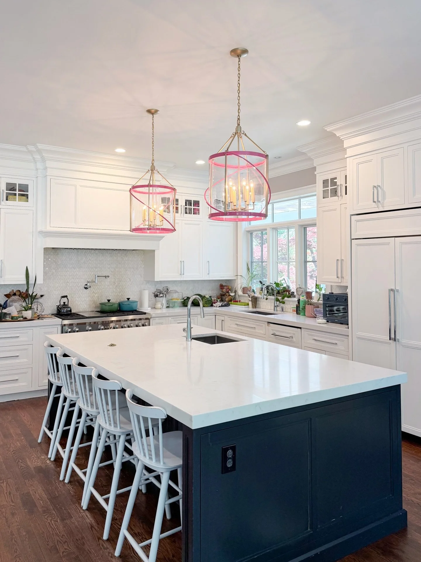 We absolutely love these @oomphhome light fixtures that we installed today in Briarcliff 💕
 
The pink accents bring an unexpected pop of color and personality to a space that&rsquo;s used constantly by a busy family with four kids. 
 
We talk a lot 