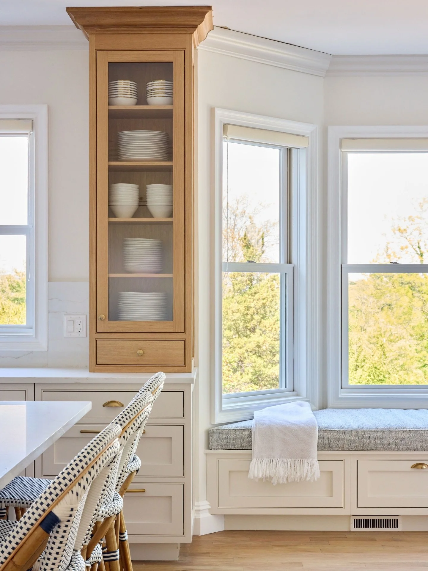 This window seat is the soul of the kitchen 🤍
 
When this family in Briarcliff Manor came to us, their kitchen was dark, cramped, and dated with a layout that fought against rather than supported the way they live. 
 
We transformed this kitchen int