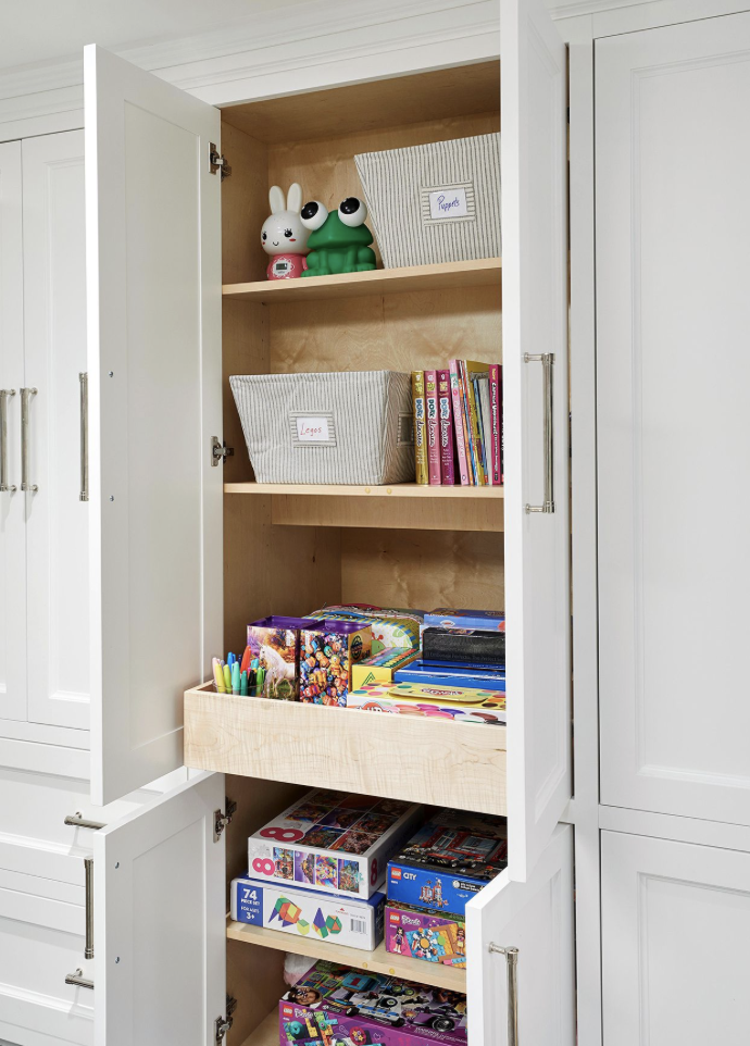 Hidden and organized storage drawers and shelves in a kids' room closet | Style and Space Interiors