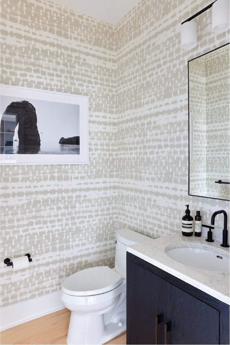 A builder-grade powder room gets transformed with patterned wallpaper and custom finishes | Style and Space Interiors NY