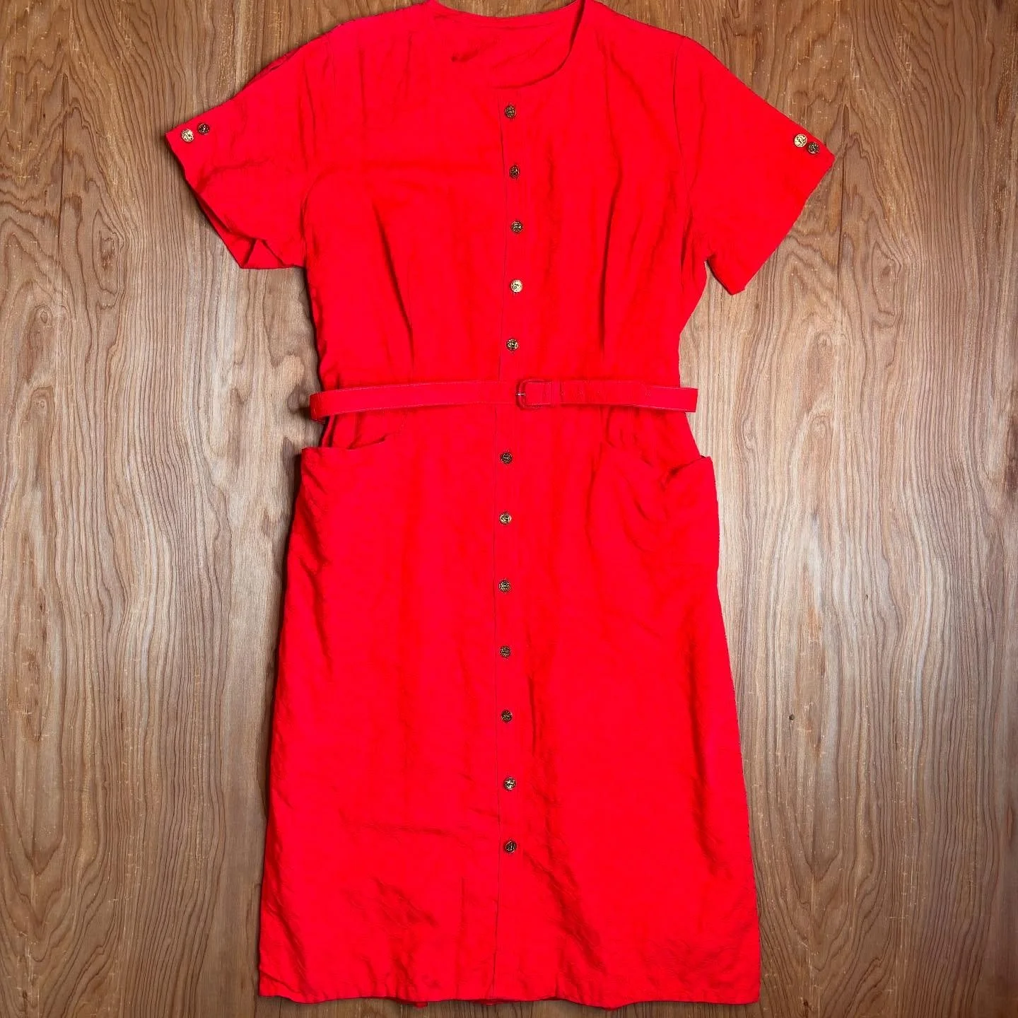 The kind of dress you toss on with a pair of slingbacks and a spritz of Chanel No. 5 before heading downtown to the record store, then out for cocktails with your tarot-reading neighbor. This vintage red stunner is classic but far from tame&mdash;fem