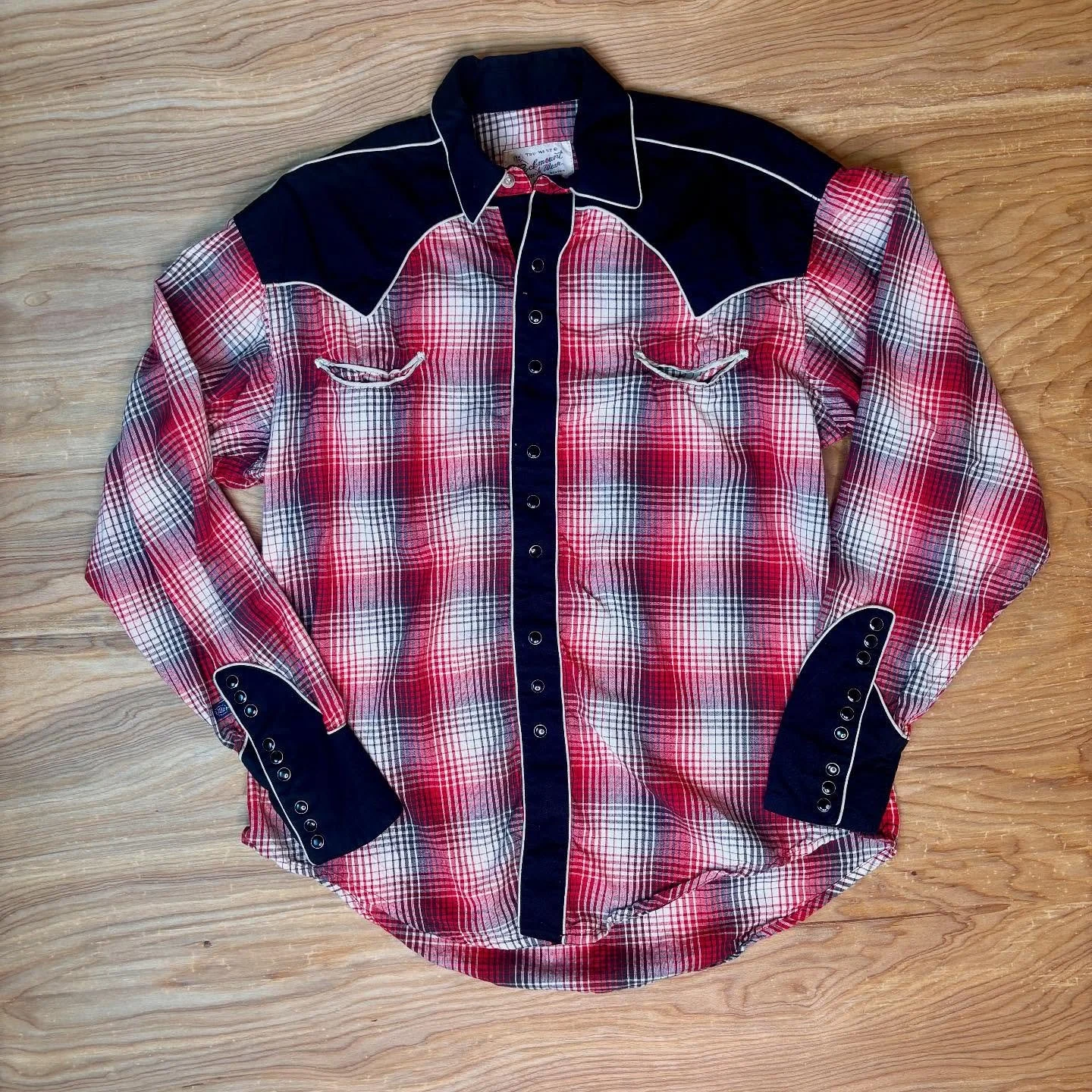 The Scarlett Hour Collection continues and this is drop #2 ❤️&zwj;🔥

A plaid pearl snap might be a western staple, but this one makes a statement. 

A vintage Rockmount Ranch Wear original, this red and black shirt is built like the old west itself: