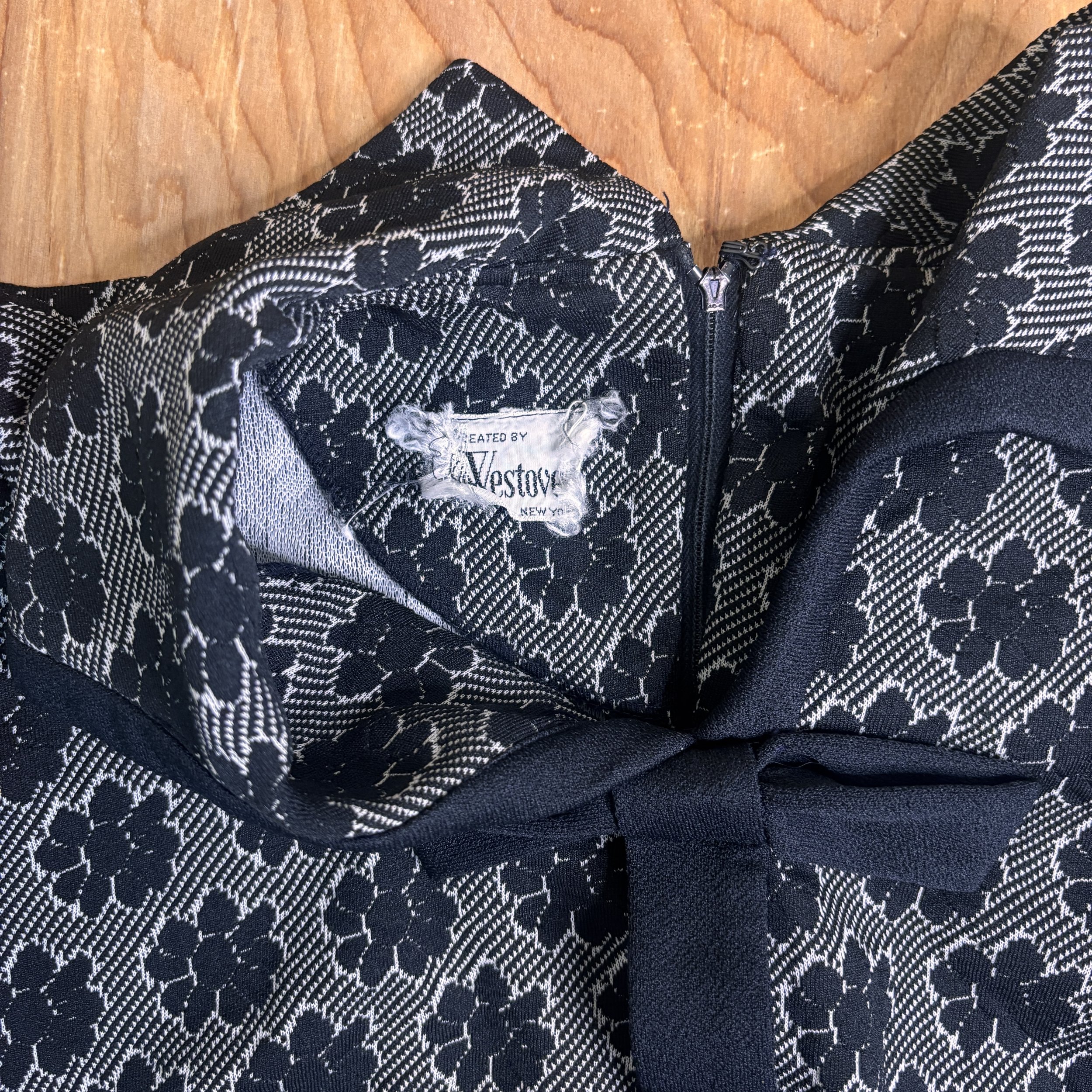 Close-up of the partially frayed “Created by Westover New York” label inside the collar.