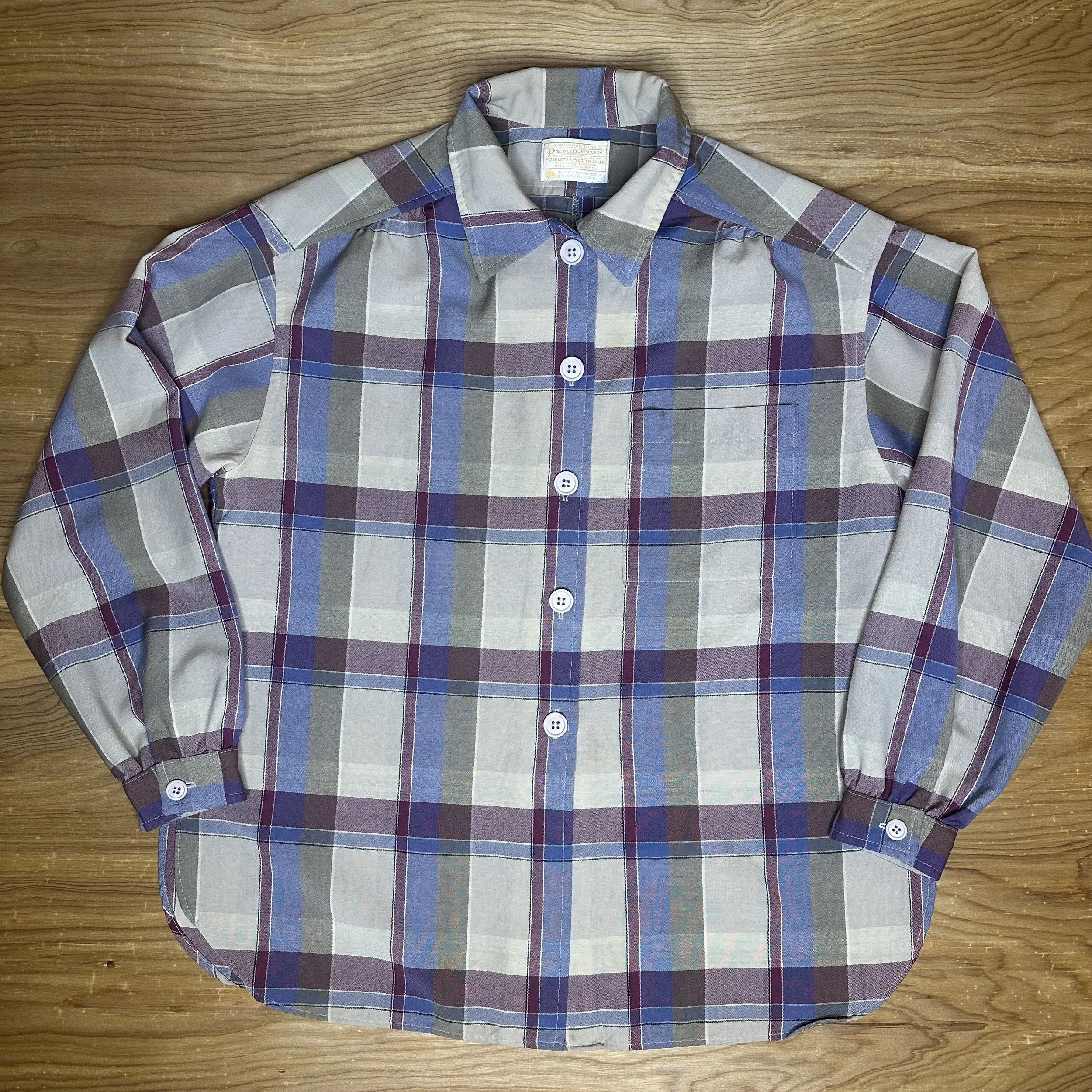 Front flat lay of vintage Pendleton plaid shirt-jacket in purple and blue