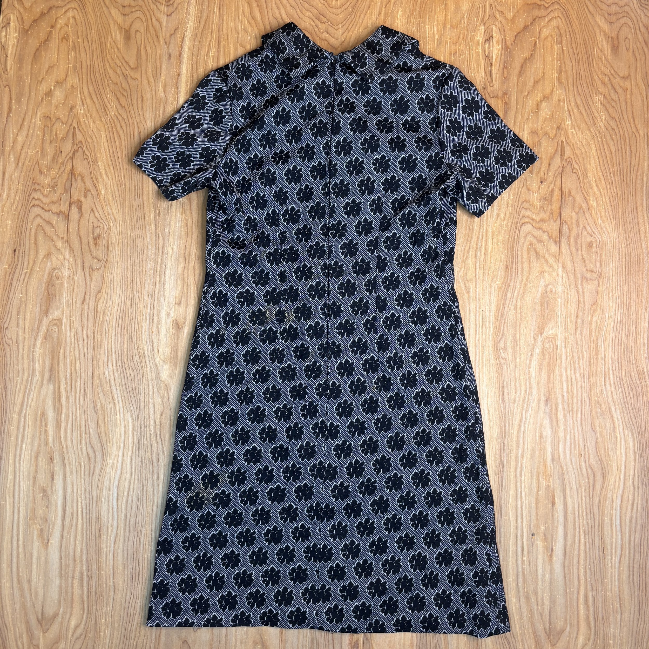 Full back view showing the dress's clean A-line silhouette and rear zipper.