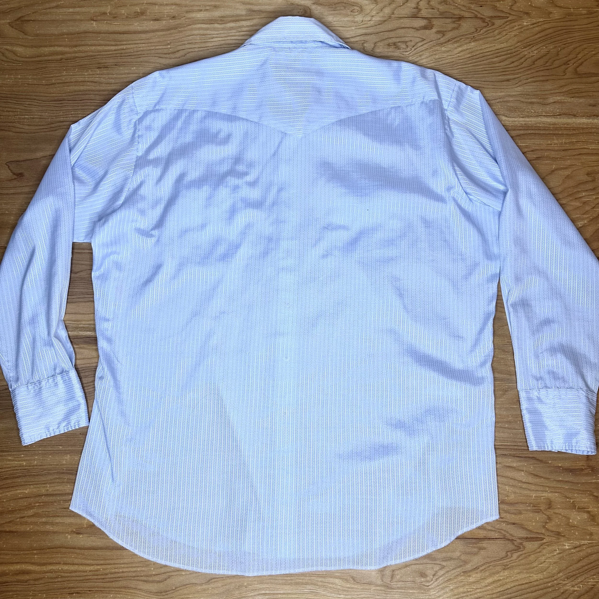 Back view of powder blue satin Western shirt with subtle sheen.
