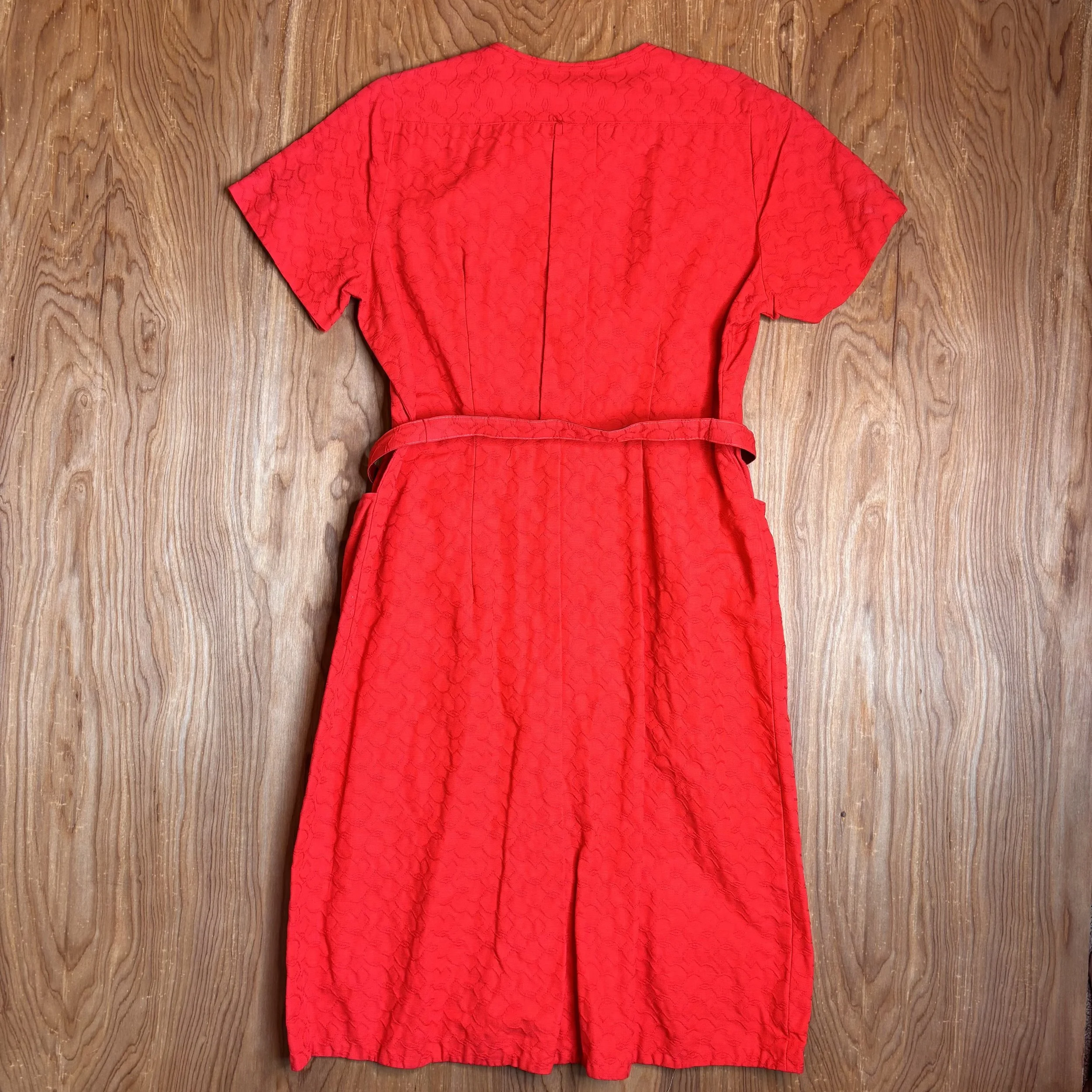 Full back view of dress on wood floor