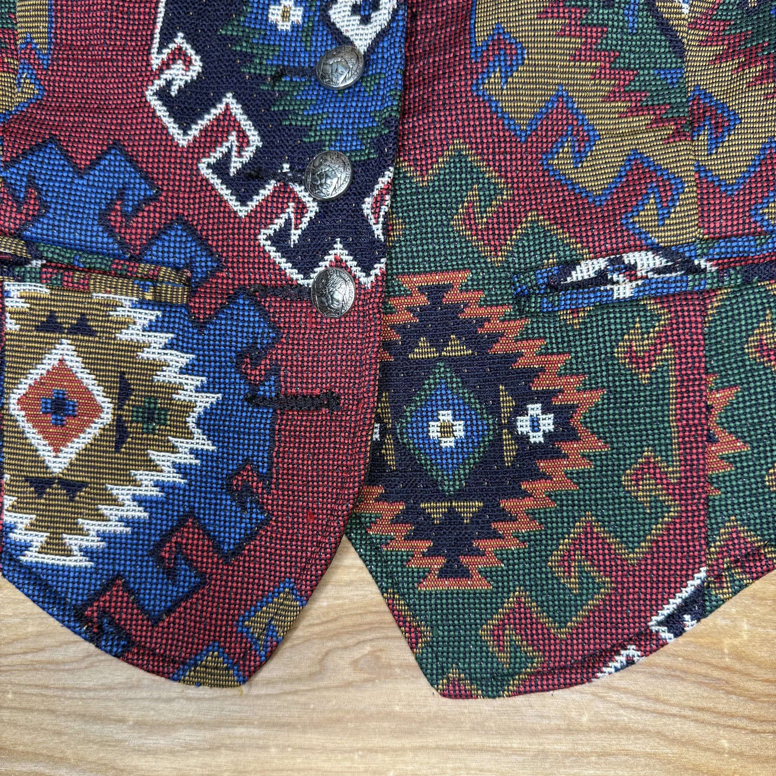 Close-up of concho-style buttons and colorful southwestern weave
