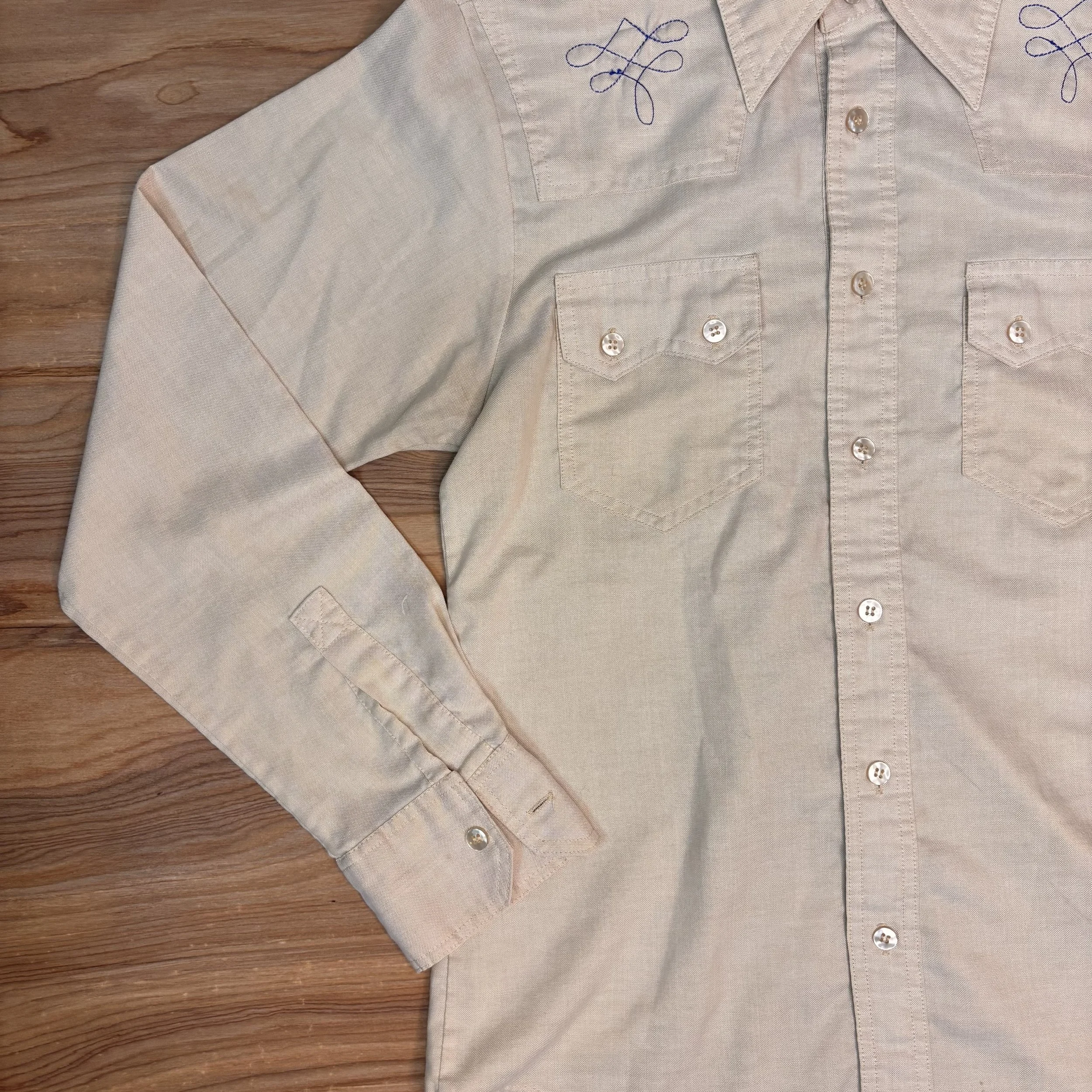 Front view of vintage Mad Man Hardwear embroidered western shirt in sand cotton with navy boot stitch