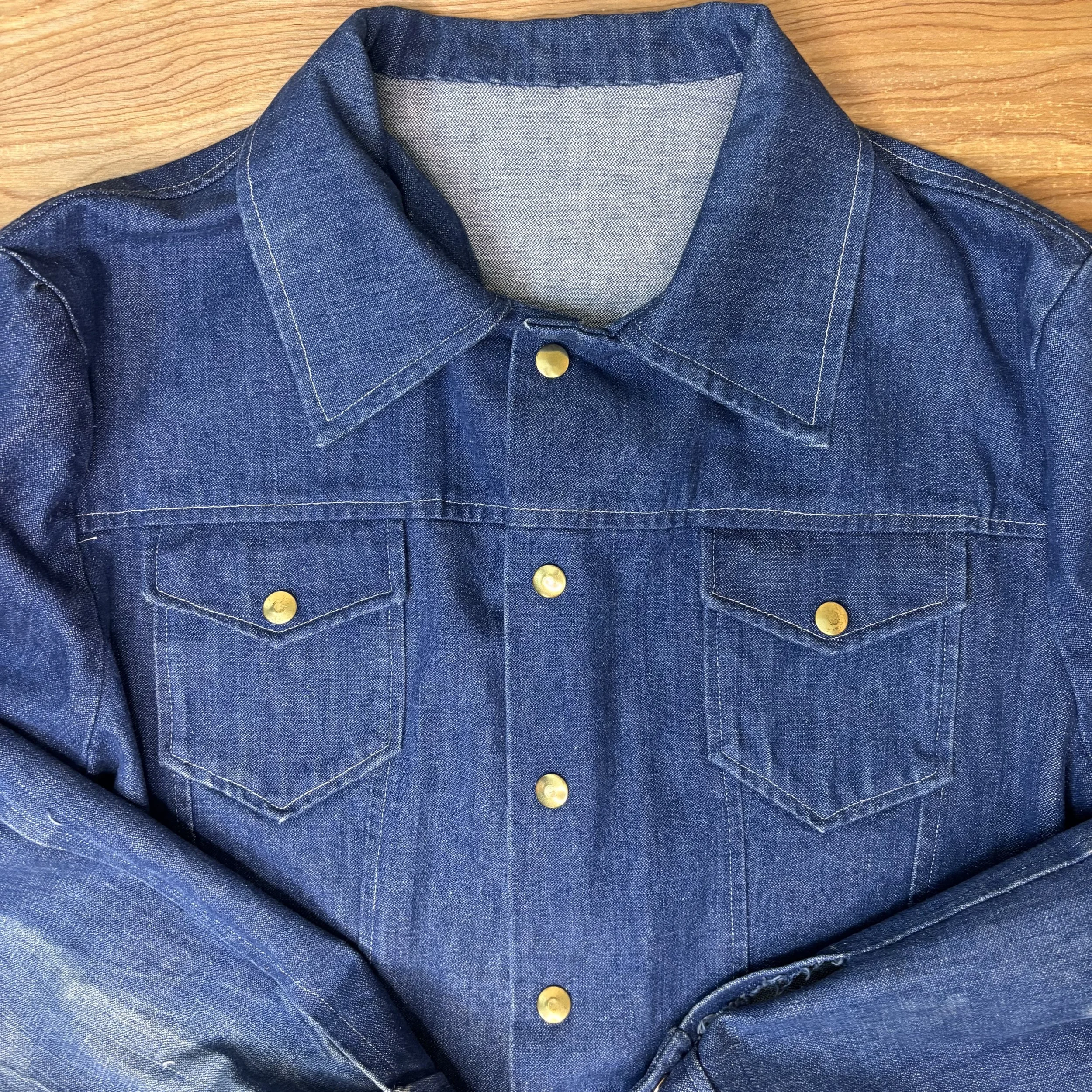 Close-up of collar and button placket on soft indigo vintage denim jacket