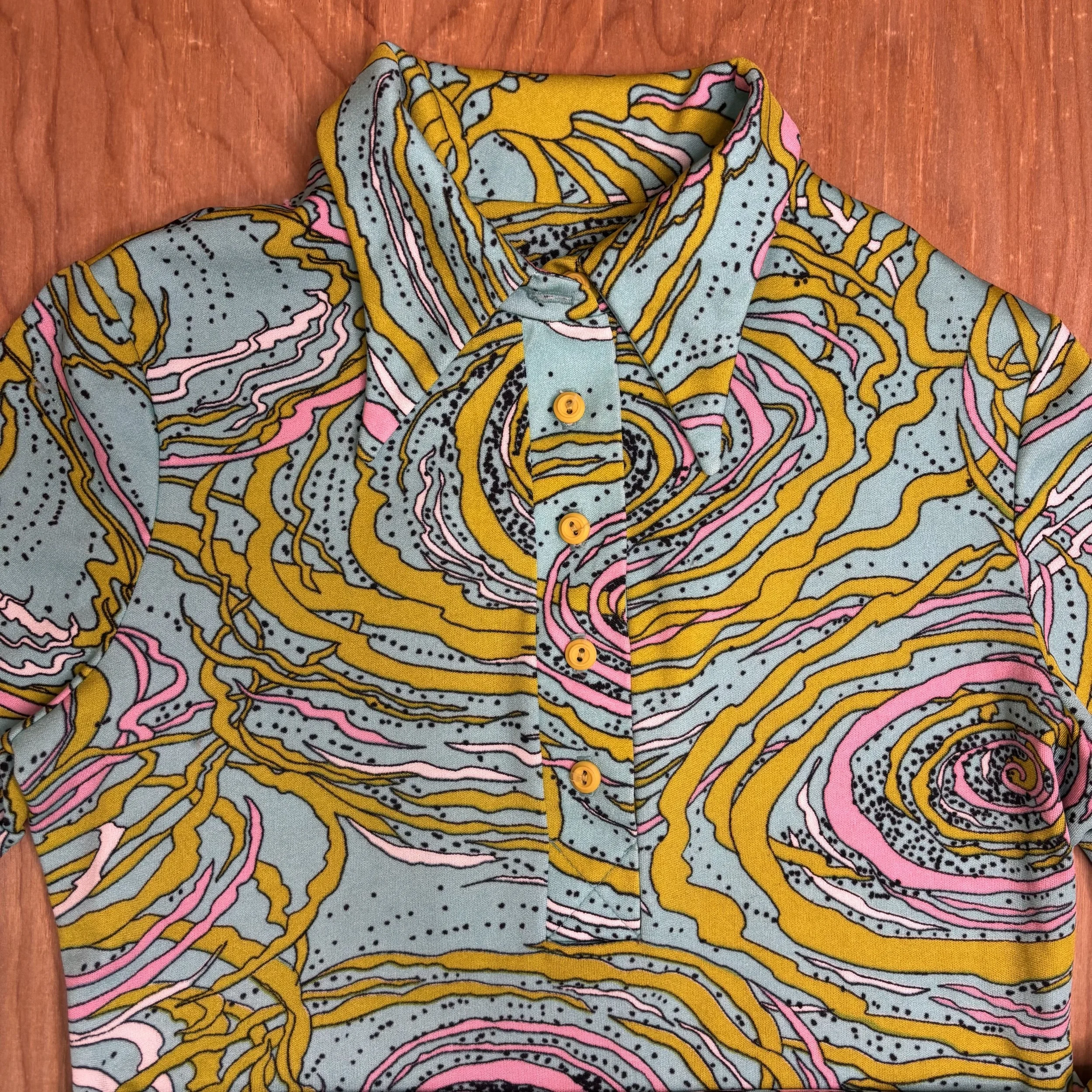 Detail of Mia Editions label and pointed collar on vintage psychedelic dress from the 1960s.