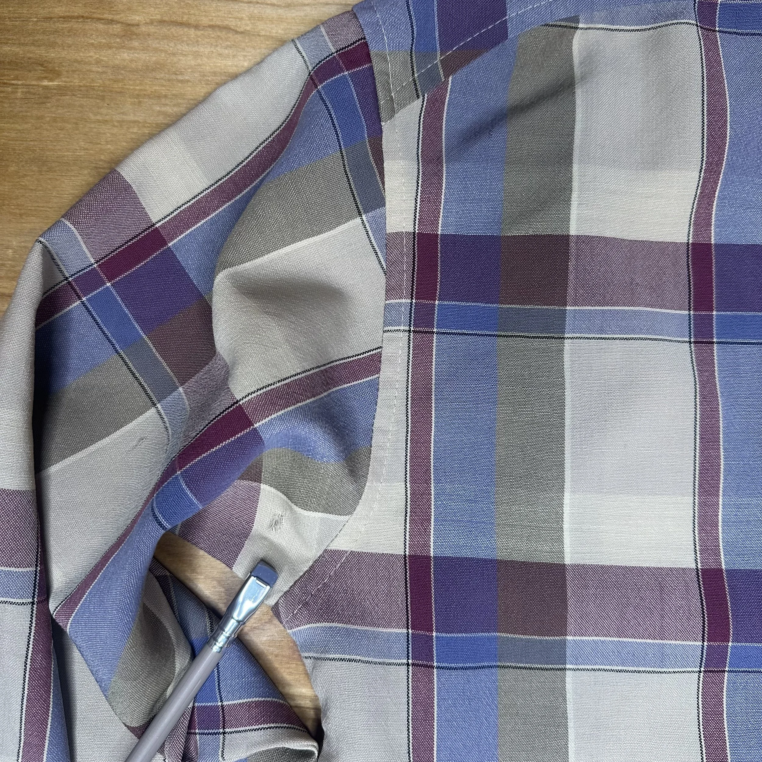 Small fabric wear and flaws on vintage Pendleton shirt hem
