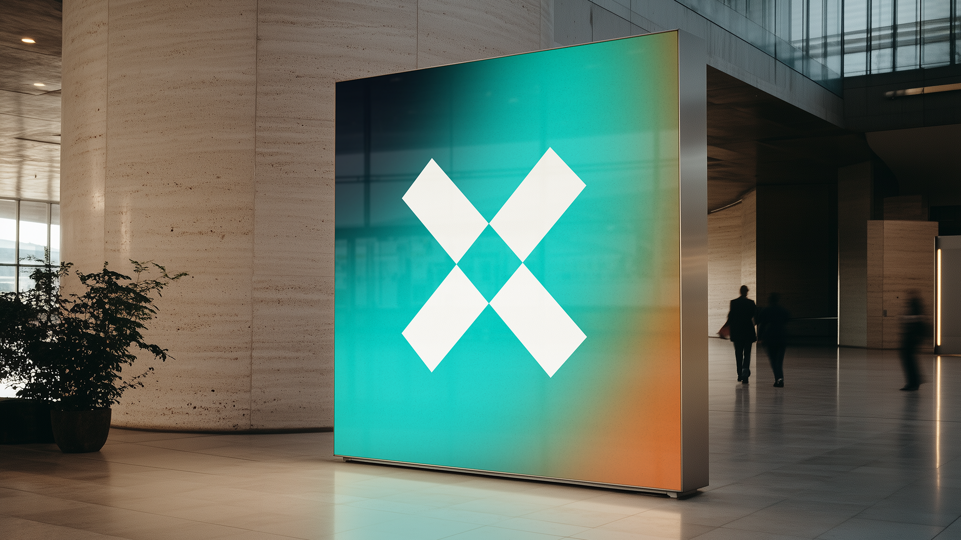 A modern digital display screen in an indoor public space showing a white geometric logo against a gradient background with teal, yellow, and orange hues. There are people walking in the background, and a plant is visible on the left side.