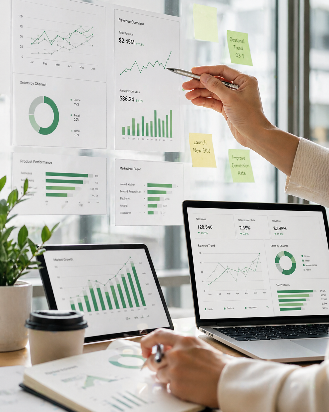 Team reviewing ecommerce dashboards, reports, and market data across screens and printed charts in a bright modern workspace.