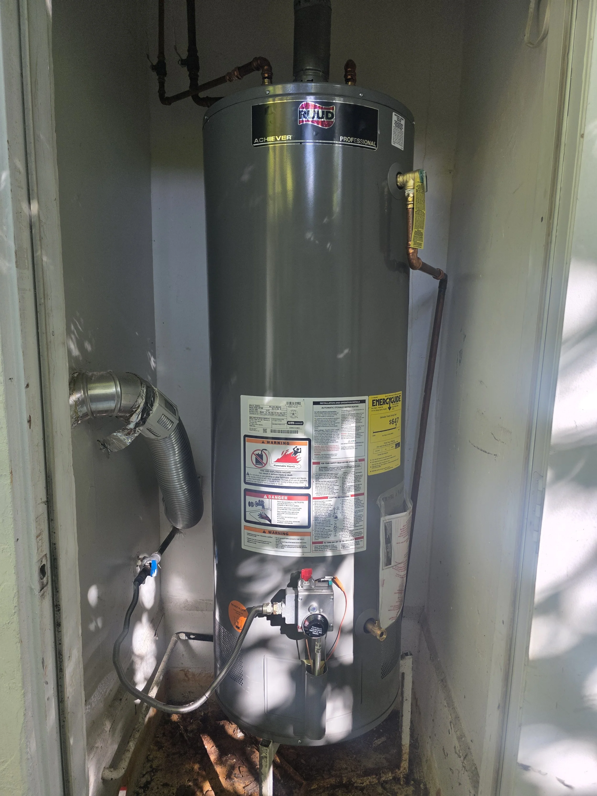 Installed residential water heater photographed on an OH Plumbing job