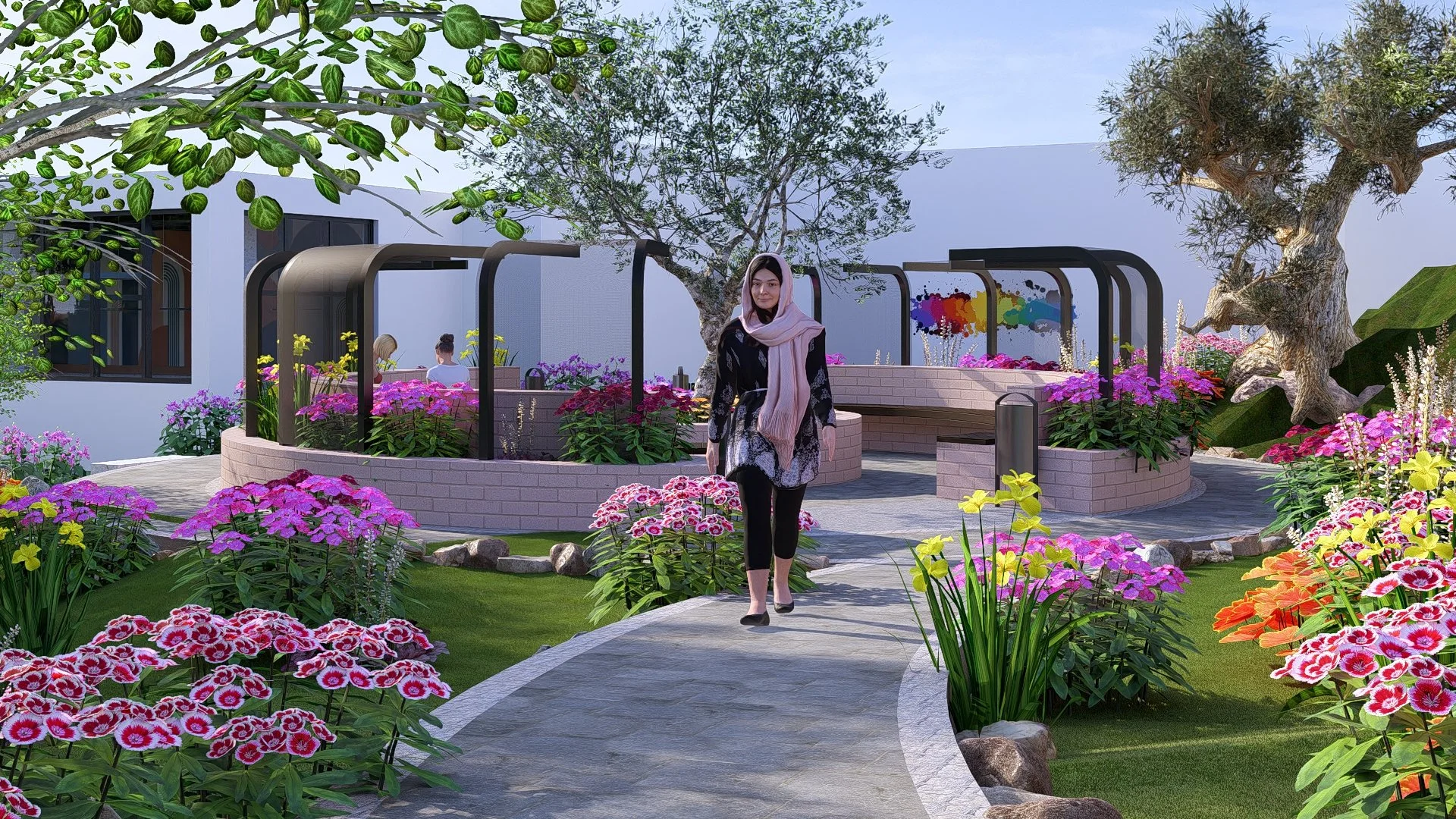 A woman walking on a curved stone pathway through a colorful garden with pink, yellow, and orange flowers, two trees, and a building in the background.