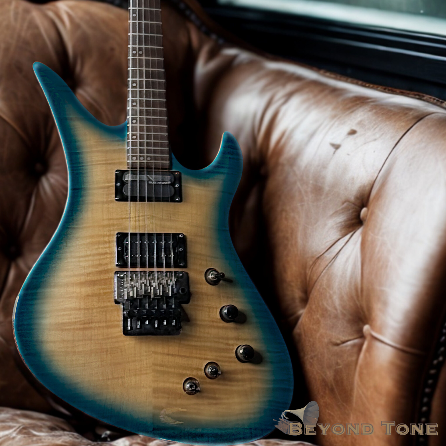 An electric guitar with a blue and natural wood finish, resting on a worn brown leather couch.