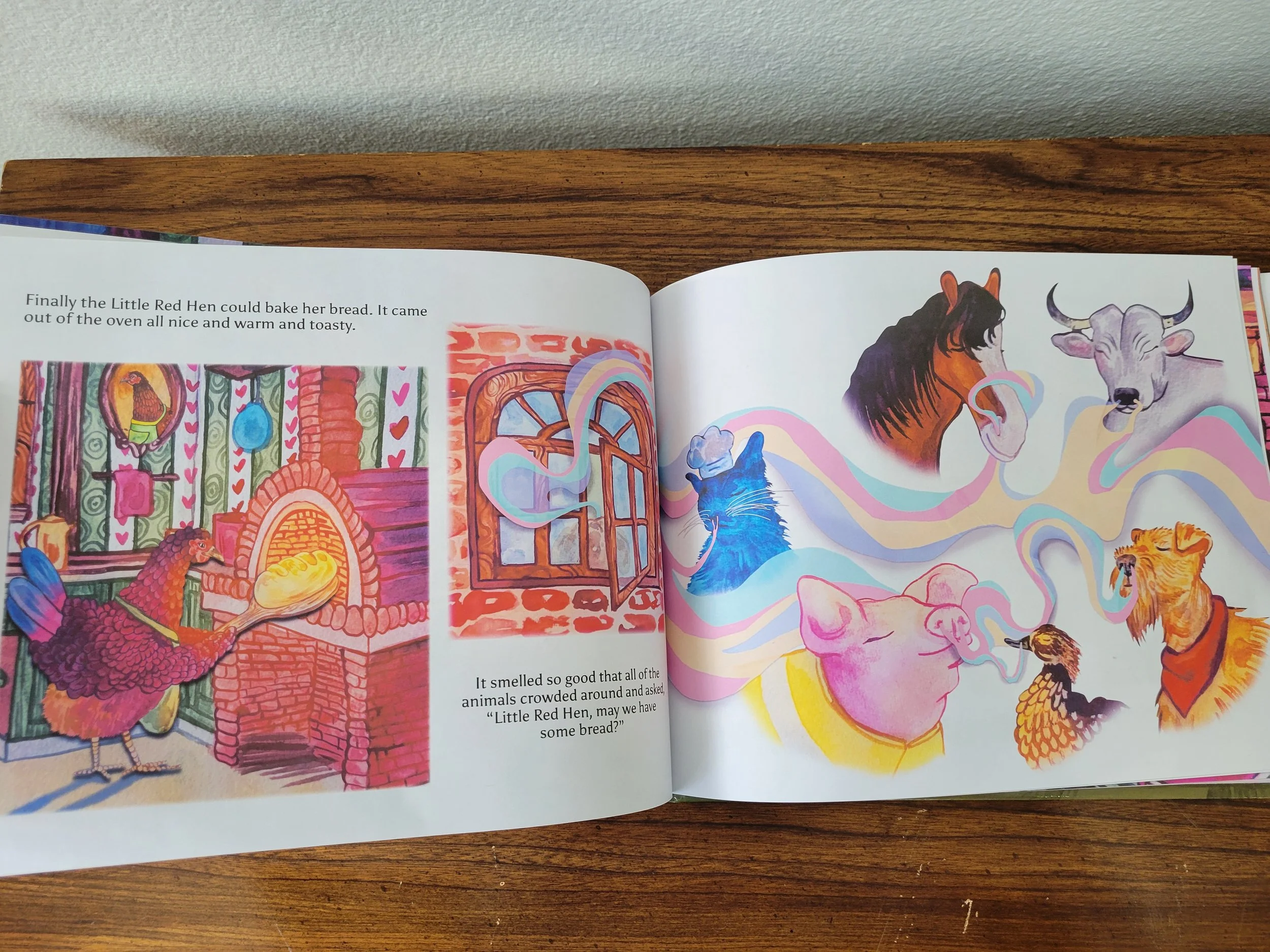 A photo of two pages of 'The Little Red Hen Learns How to Ask for Help.' The full cast is seen smelling the delicious bread.