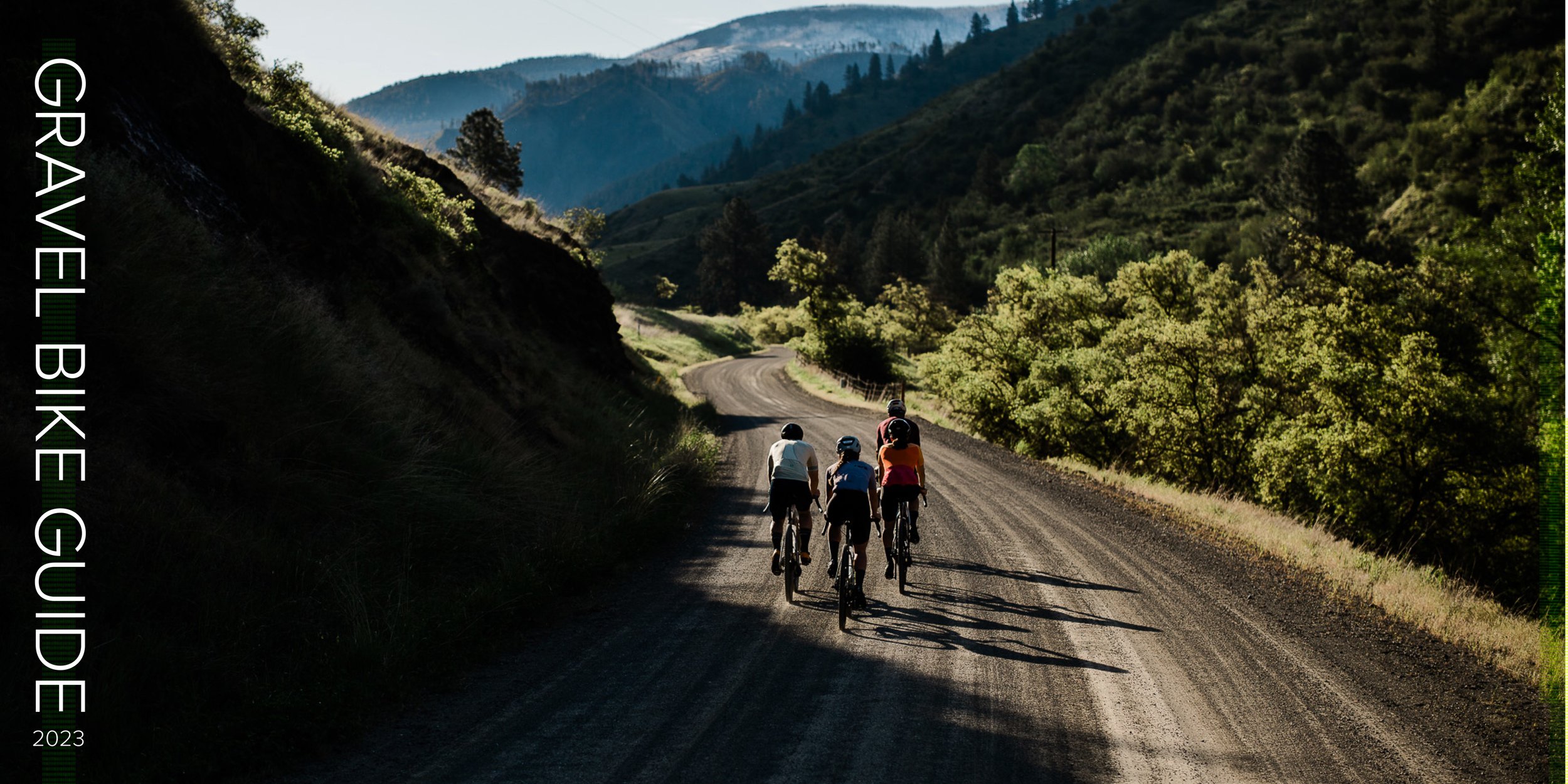 4 riders ascending up a gravel road in the mountains