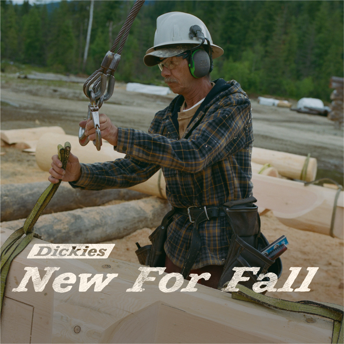 Man clipping cable to log wearing Dickies Shirt Jacket, headline reads Dickies (logo) New For Fall