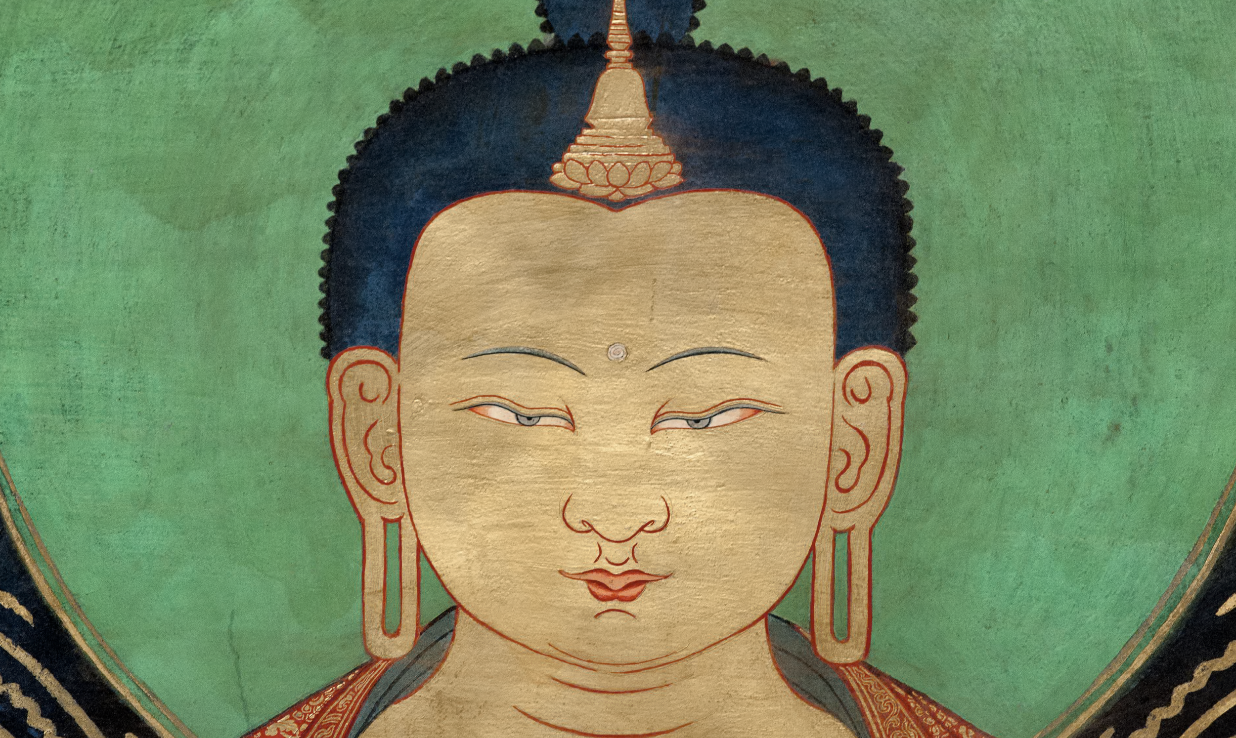 Detail of a traditional Tibetan Buddhist thangka painting showing the serene face of a Buddha or deity with a gold background, symbolizing clarity, compassion, and contemplative awareness.